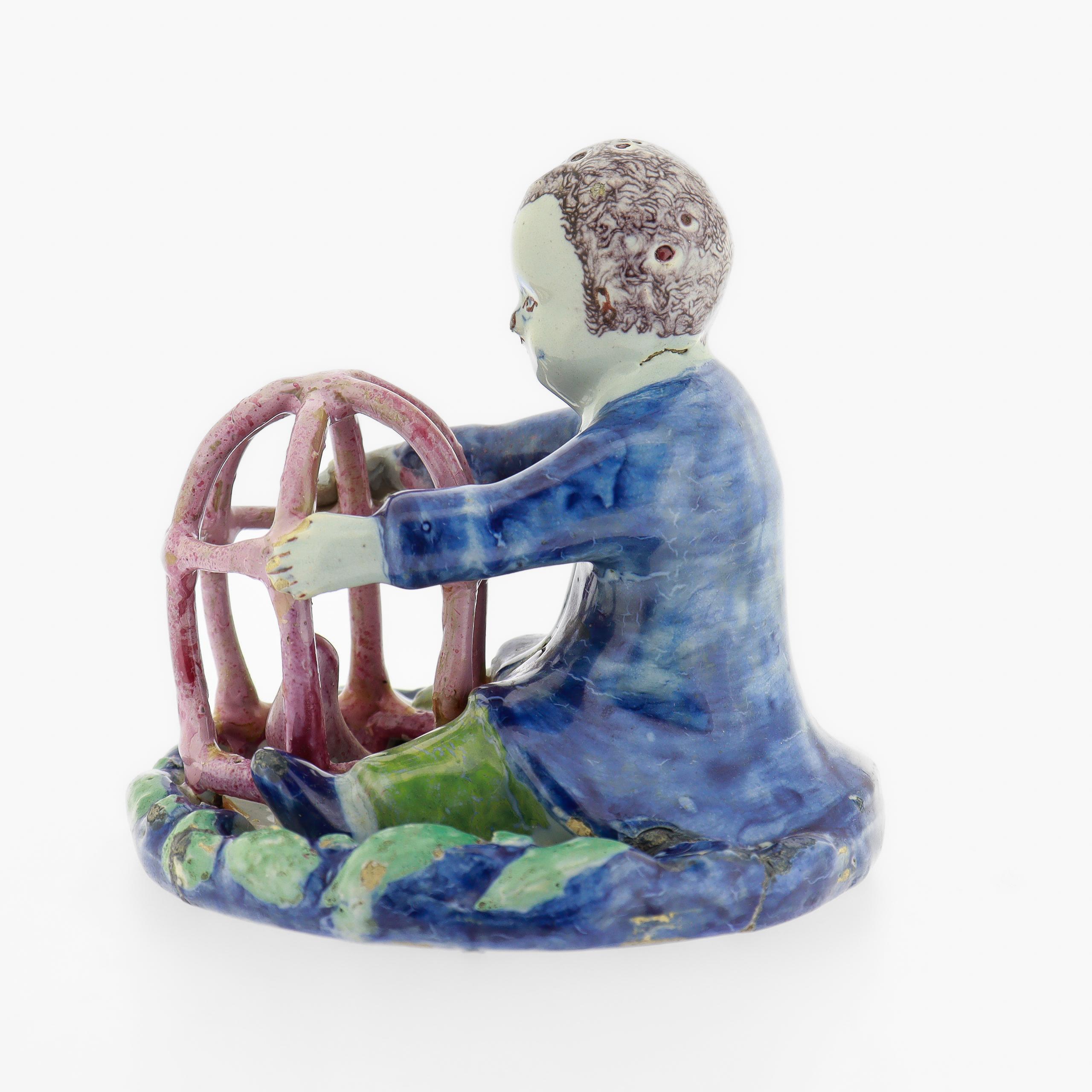 Baroque Antique 18th Century Dutch Delft Figurine of a Boy holding a Birdcage with Bird For Sale