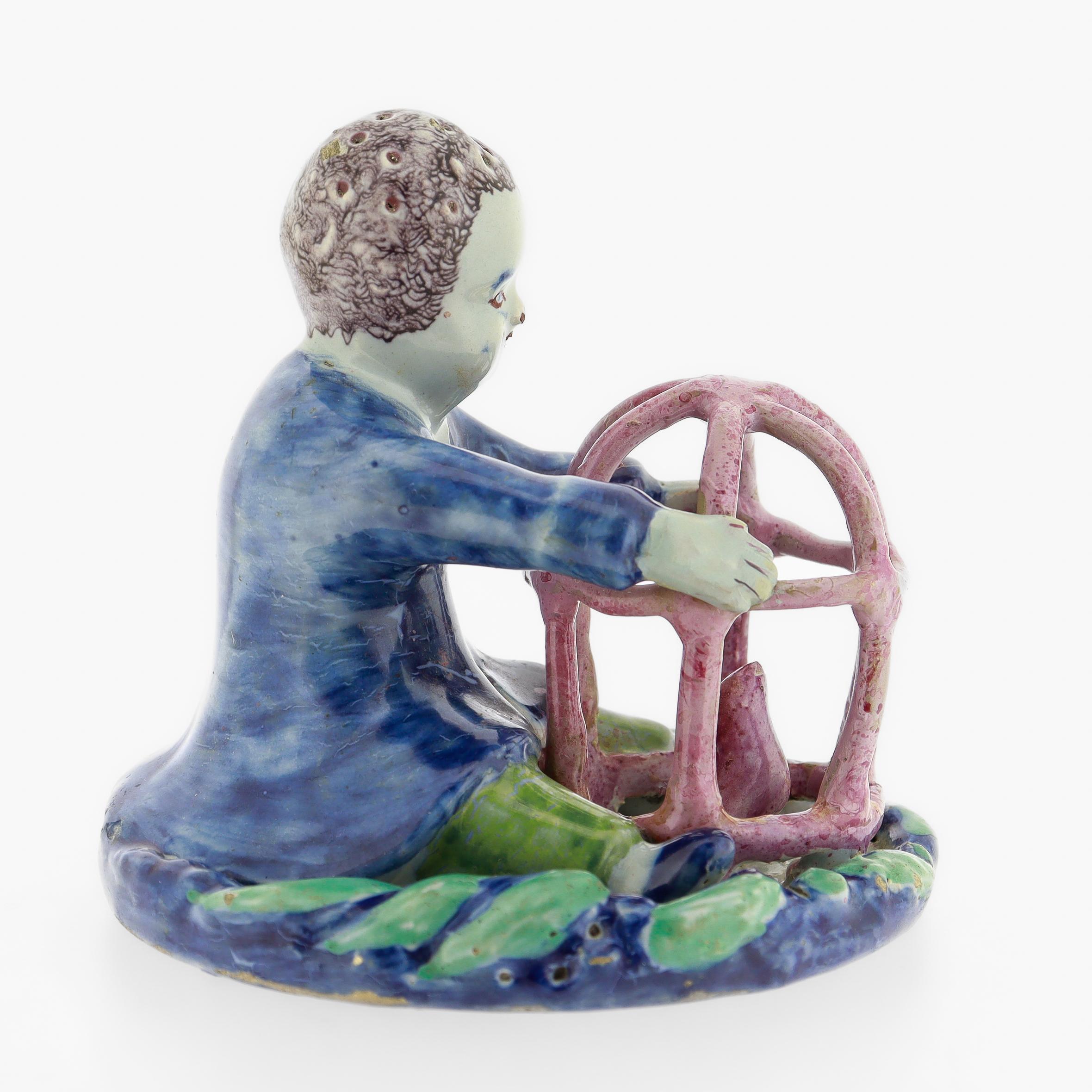18th Century and Earlier Antique 18th Century Dutch Delft Figurine of a Boy holding a Birdcage with Bird For Sale