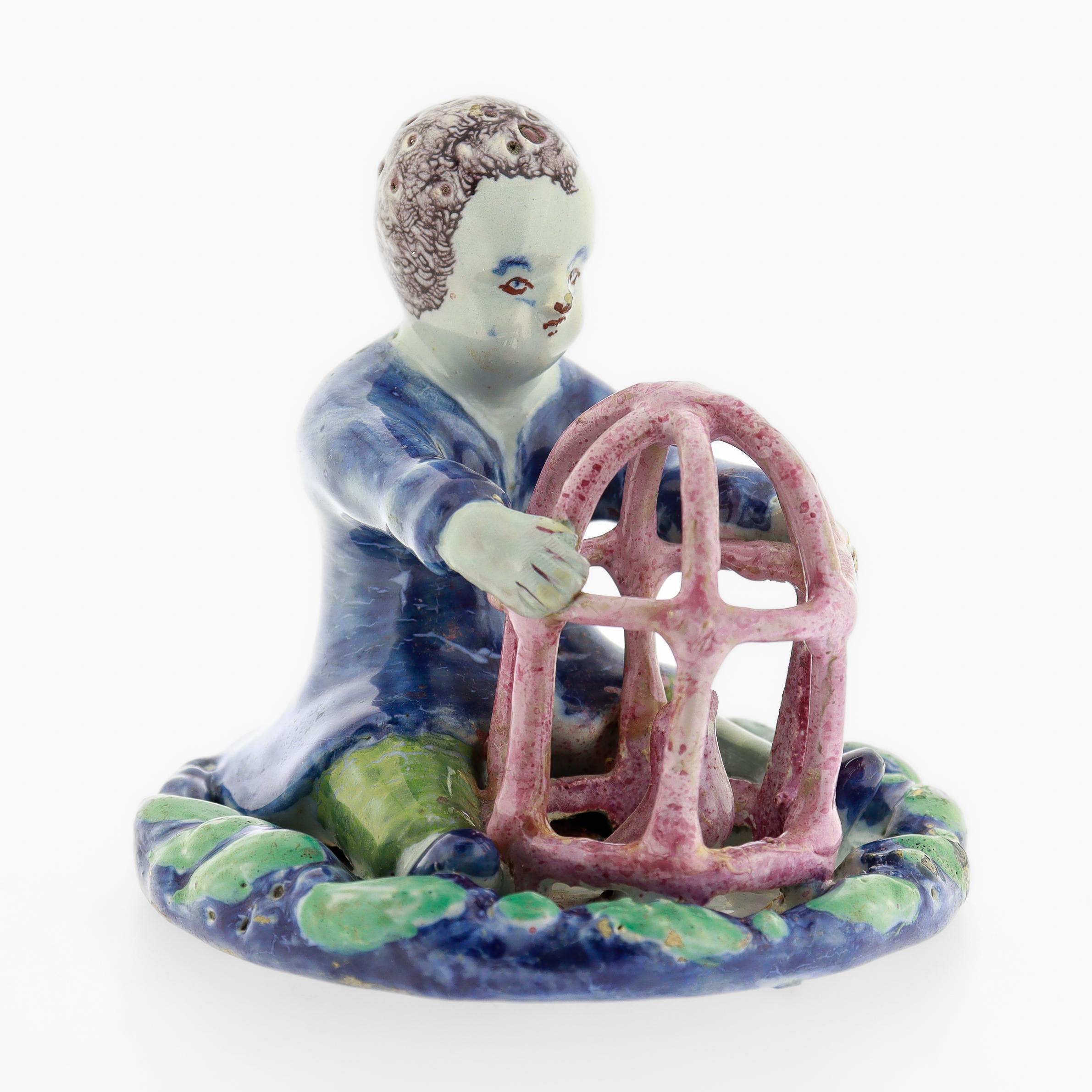 Antique 18th Century Dutch Delft Figurine of a Boy holding a Birdcage with Bird For Sale 1