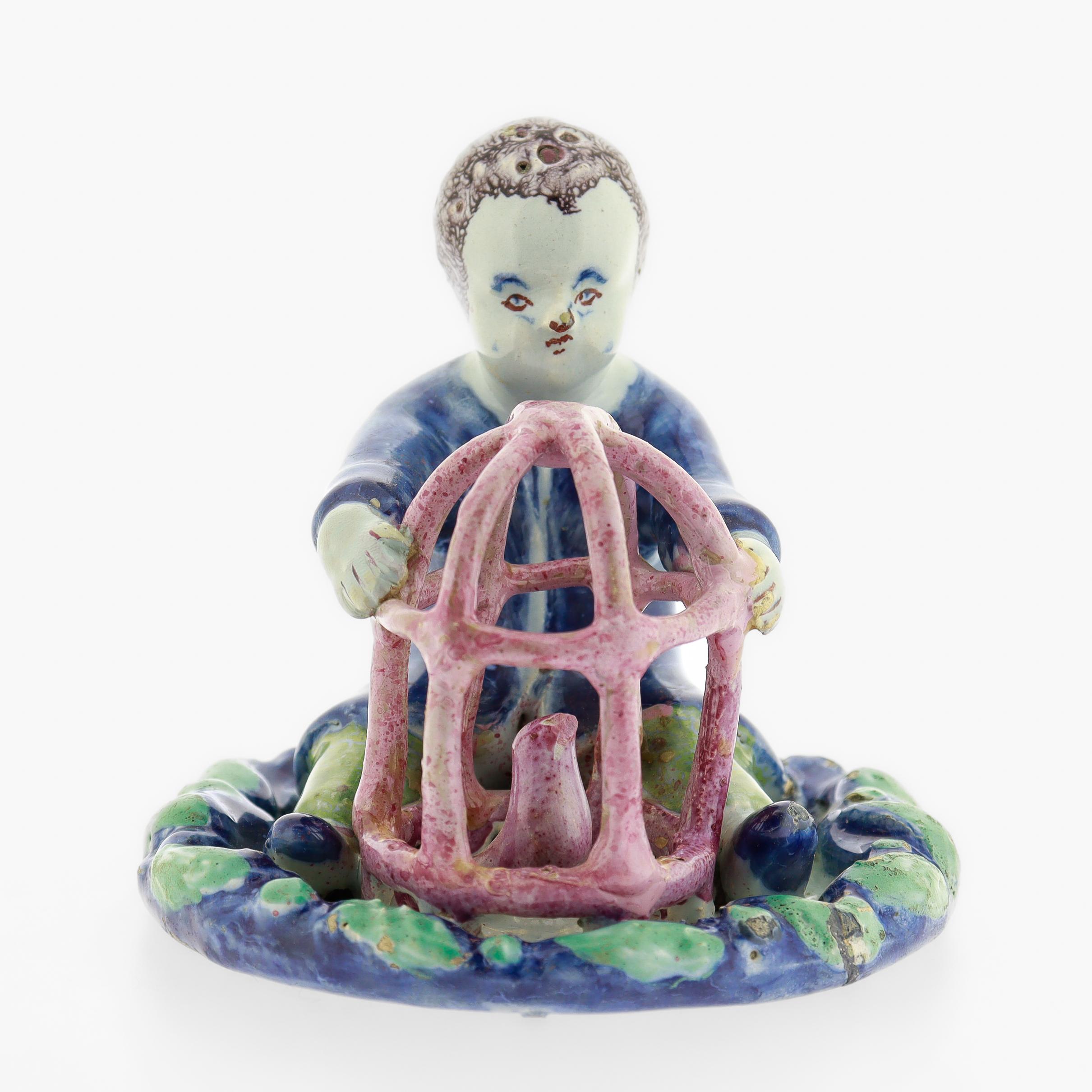 Antique 18th Century Dutch Delft Figurine of a Boy holding a Birdcage with Bird For Sale 2