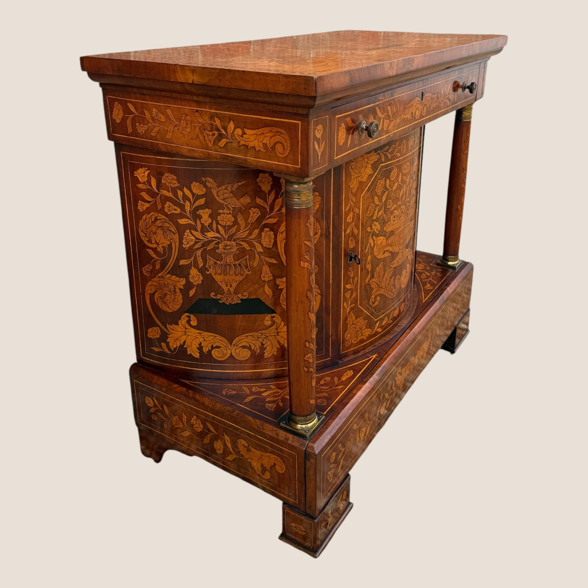 Here we have an antique late 18th century, circa 1790, Dutch Marquetry Mahogany Console Wall Table with a Cupboard and 2 Drawers. The table top is an incredible showcase of Dutch marquetry inlay with intricate floral details, birds and urns,