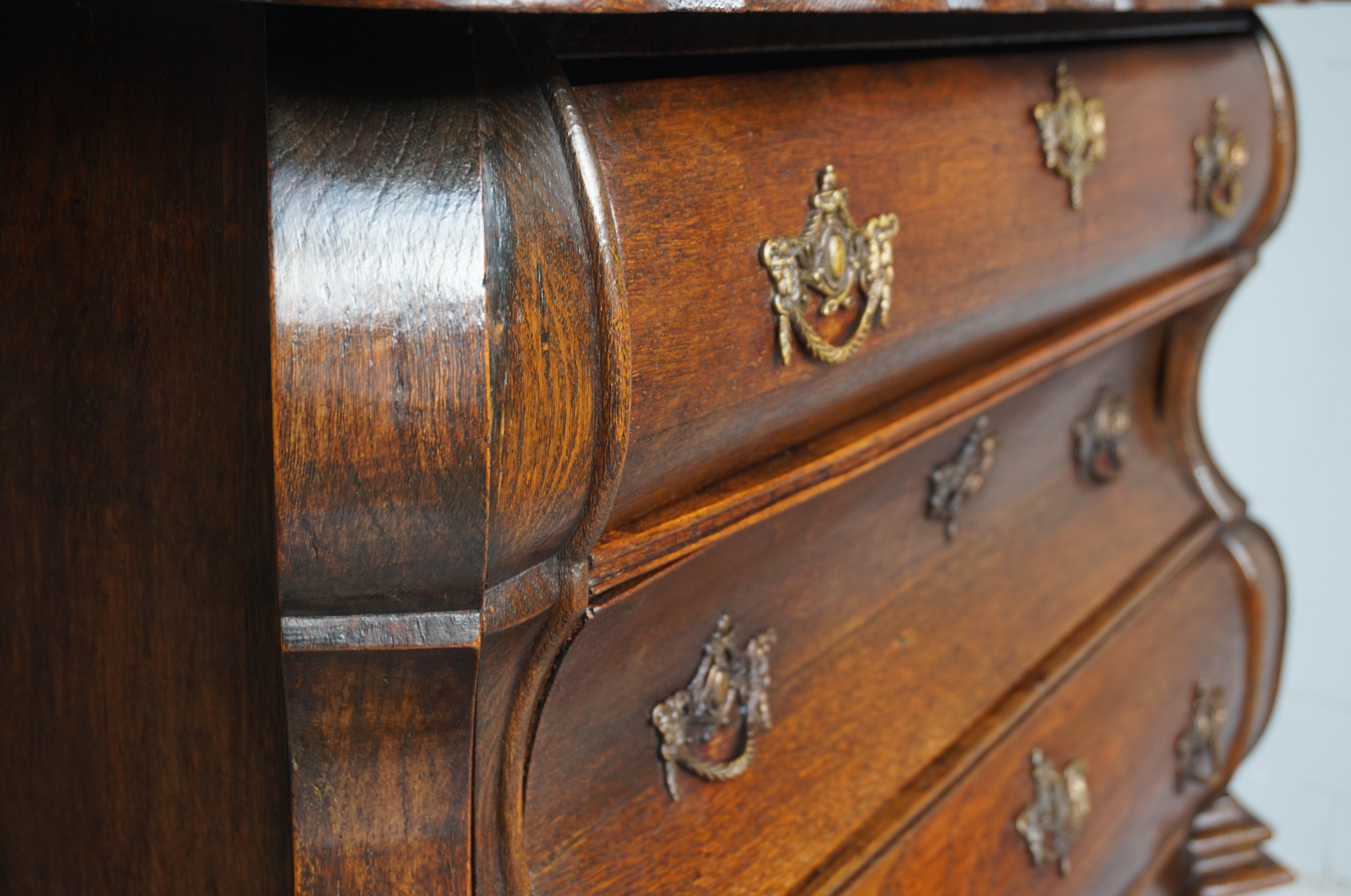 Cast Antique 18th Century Dutch Rococo Oak Bomb Chest of Drawers with Claw Feet For Sale