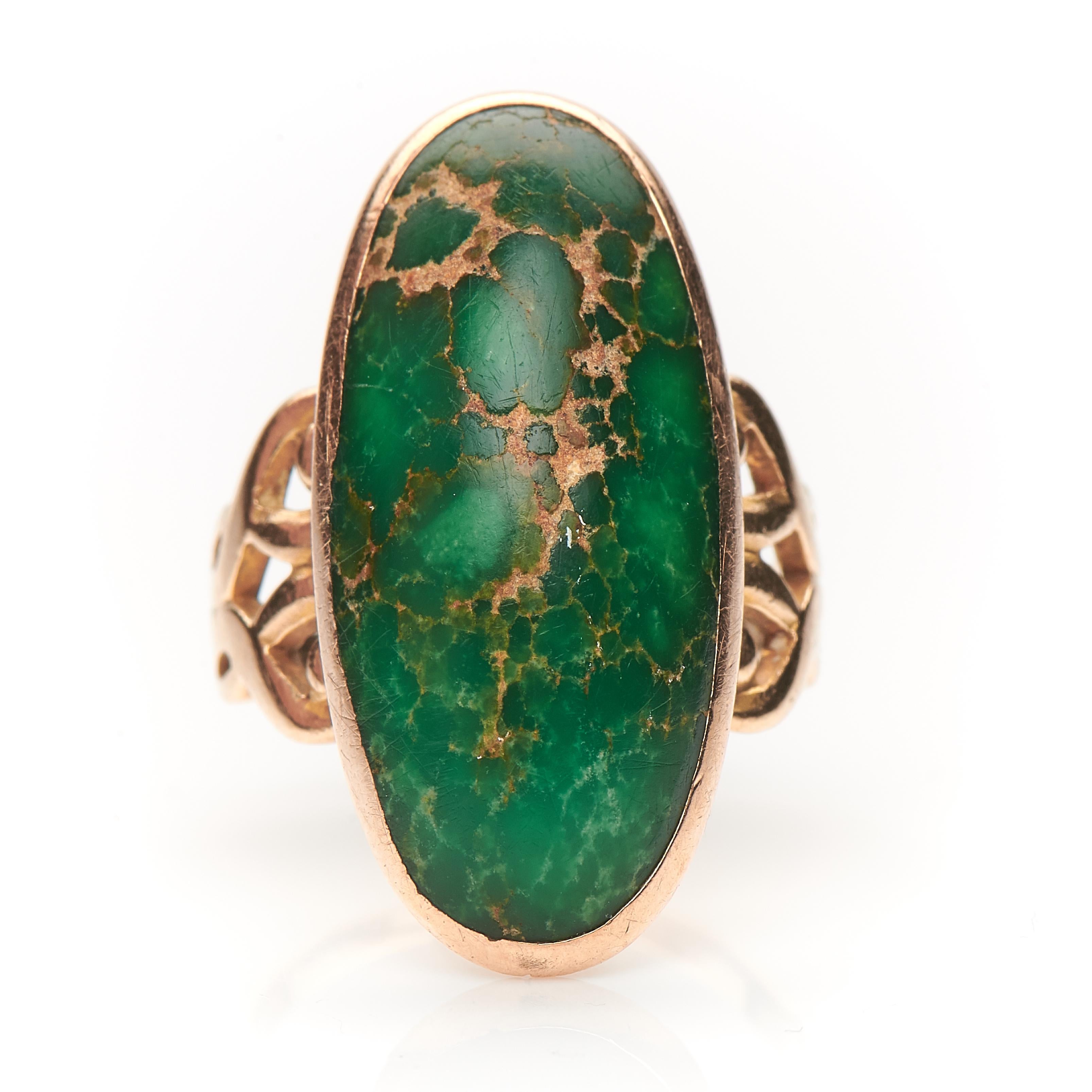 A beautiful early natural turquoise ring, circa 1790. The turquoise has become a wonderful colour with green tones over the last 200 years, set in a gold rubover setting with Celtic design shoulders. It feels wonderful in the hand, beautiful
