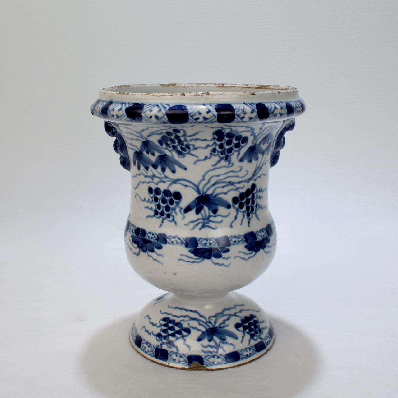 A fine 18th century English delftware pottery urn or footed vase.

With rich blue and white decoration throughout.

Likely Bristol.

Measures: Height ca. 7 1/4 in.

Provenance: Gary Atkins (with his old pricing stickers & inventory