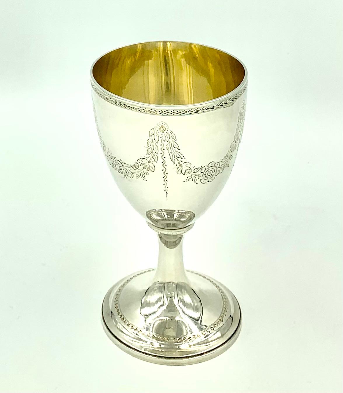 Very fine quality George III period sterling silver wine goblet
London, 1783.
Exceptional engraving on this piece, elegant garlands of acanthus leaf and roses held by quatrefoil rosettes at each crest with a long, lovely decorative tendril.
Ornate