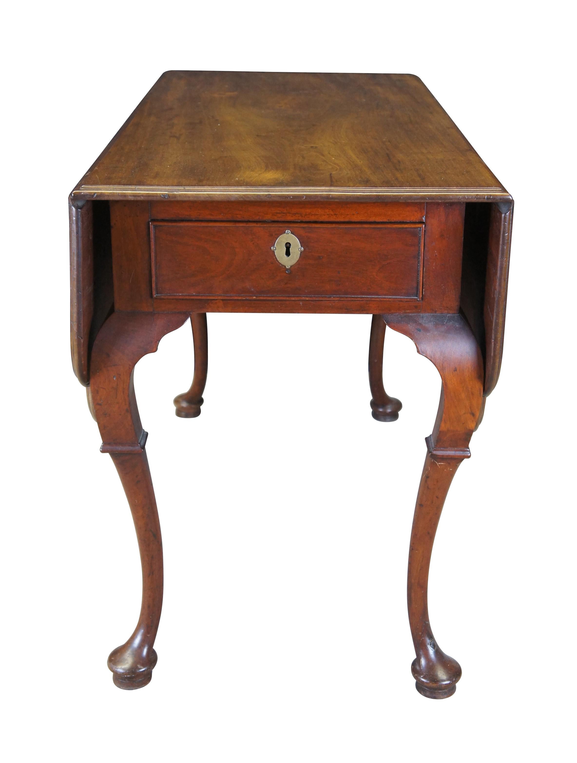 Antique 18th century George II style mahogany drop leaf library / breakfast console table.  Made of mahogany featuring large notched leaves with double sided drawers and cabriole pad foot legs.

Dimensions:
42