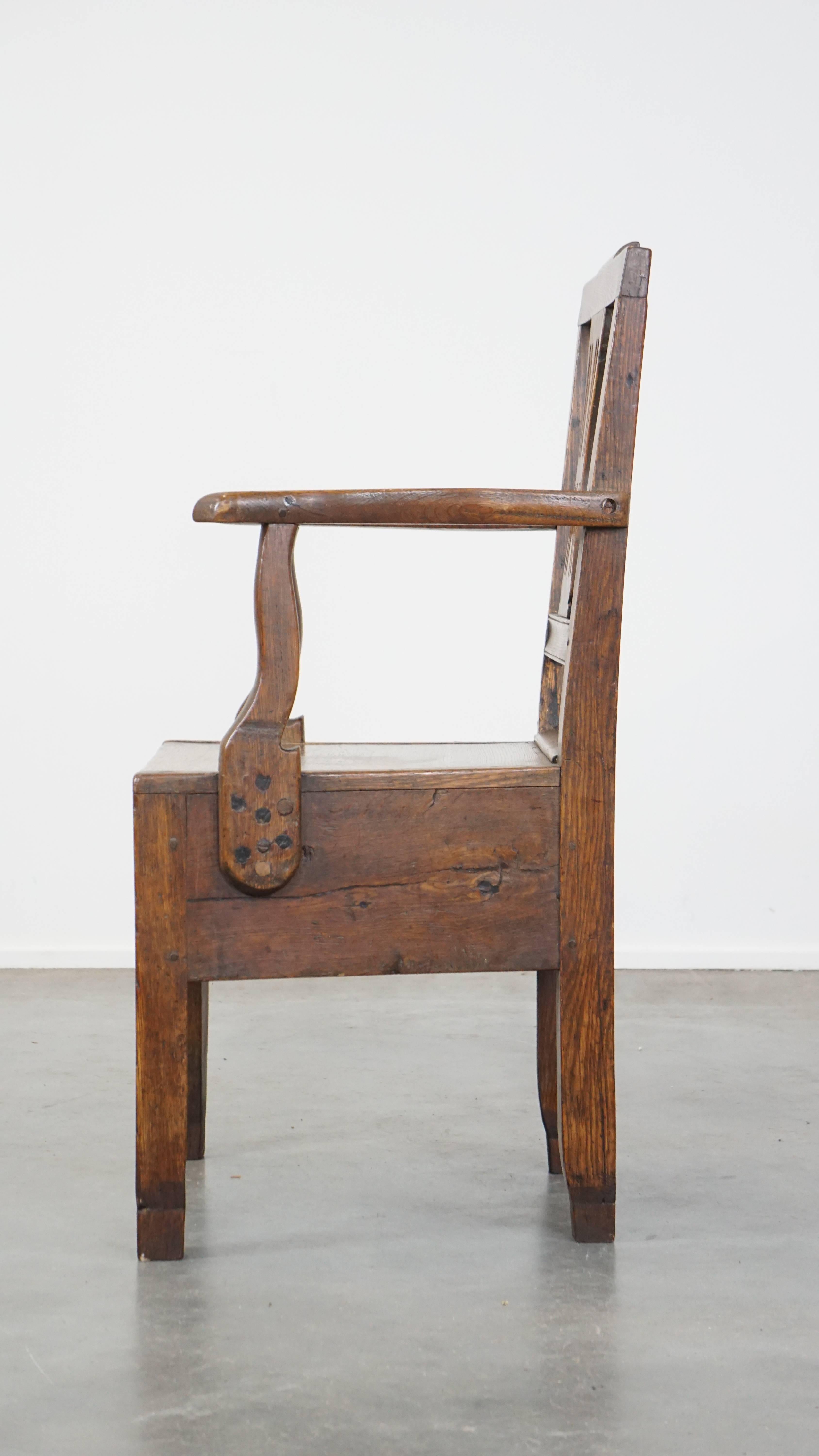 18th Century and Earlier Antique 18th-century English oak armchair with armrests and an ornament For Sale
