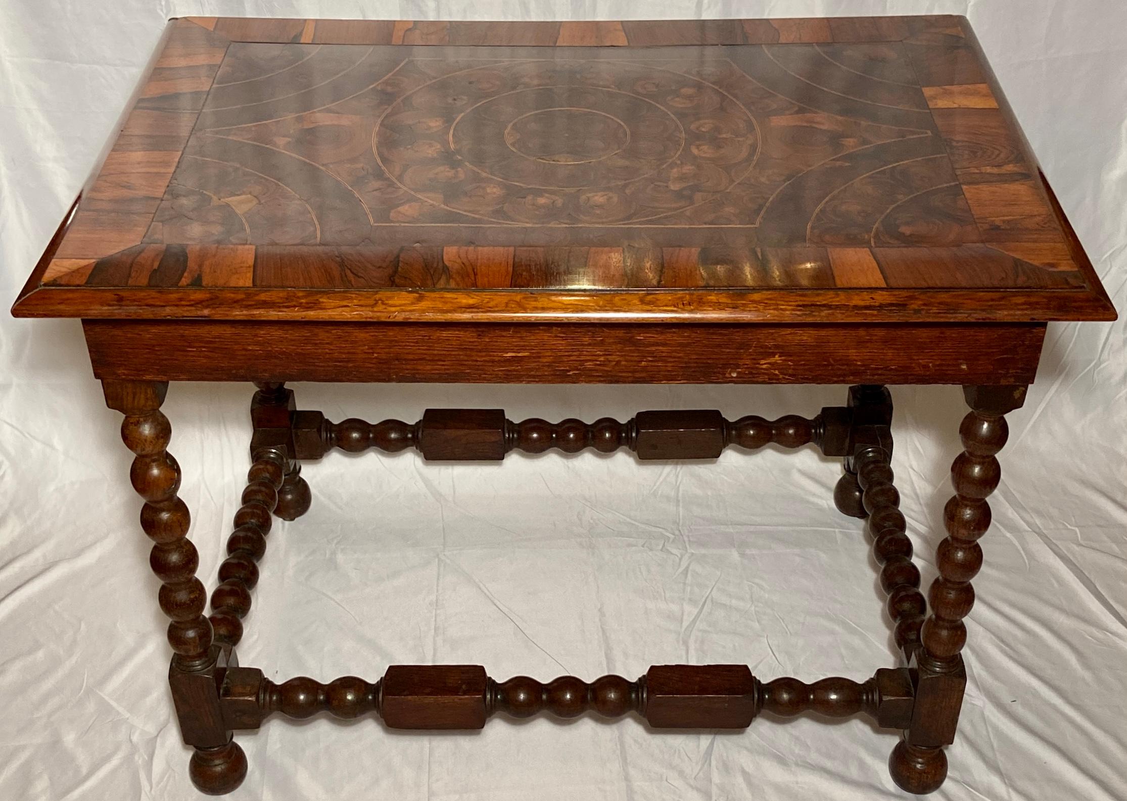 Antique 18th century English William and Mary oyster veneer-top table on later base.