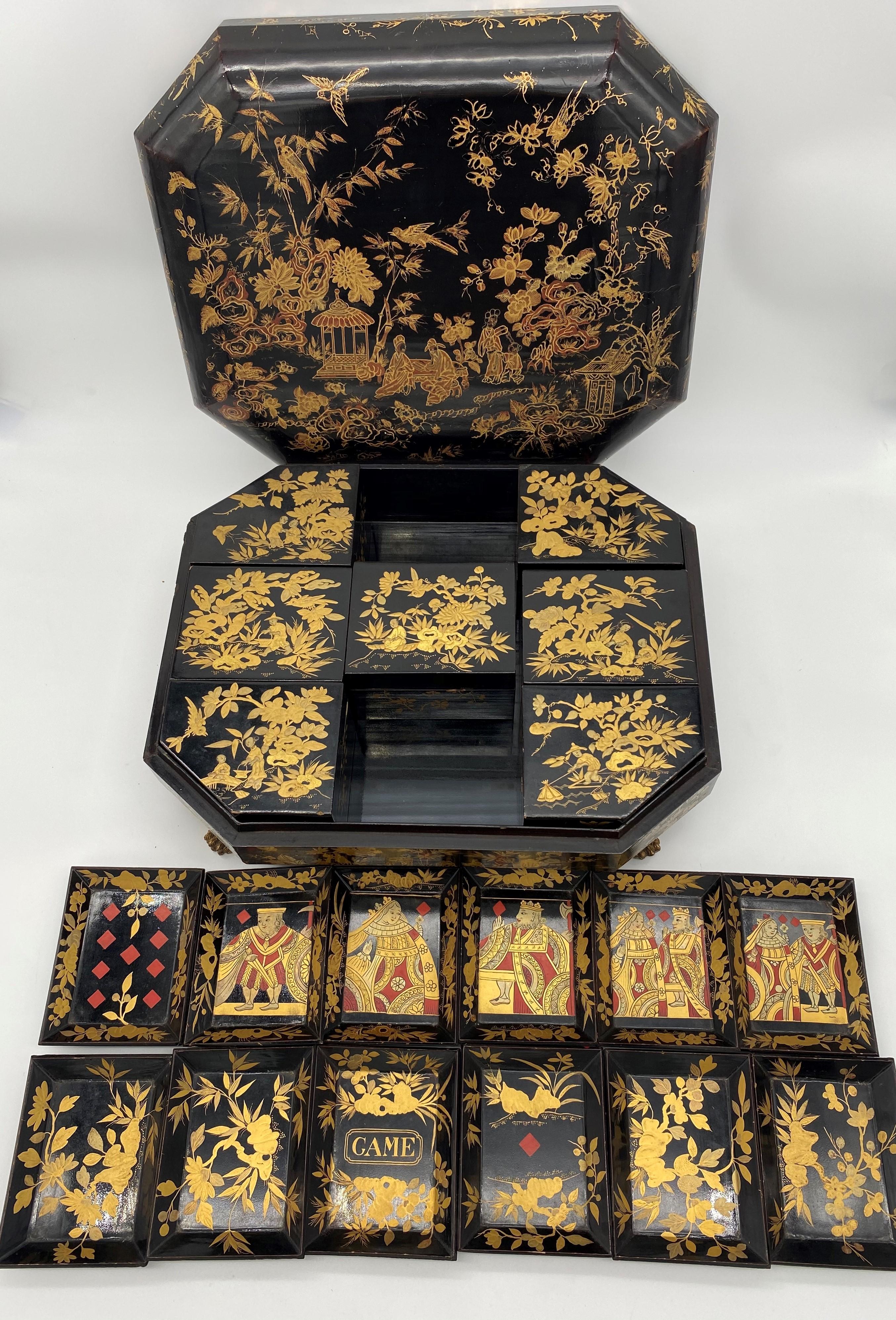 Antique 18th century export Chinese lacquer gaming box with hand painted scenes gilt export black lacquer, there are 7 gaming boxes and 12 trays, size: 15inch x 12 x 4.5.