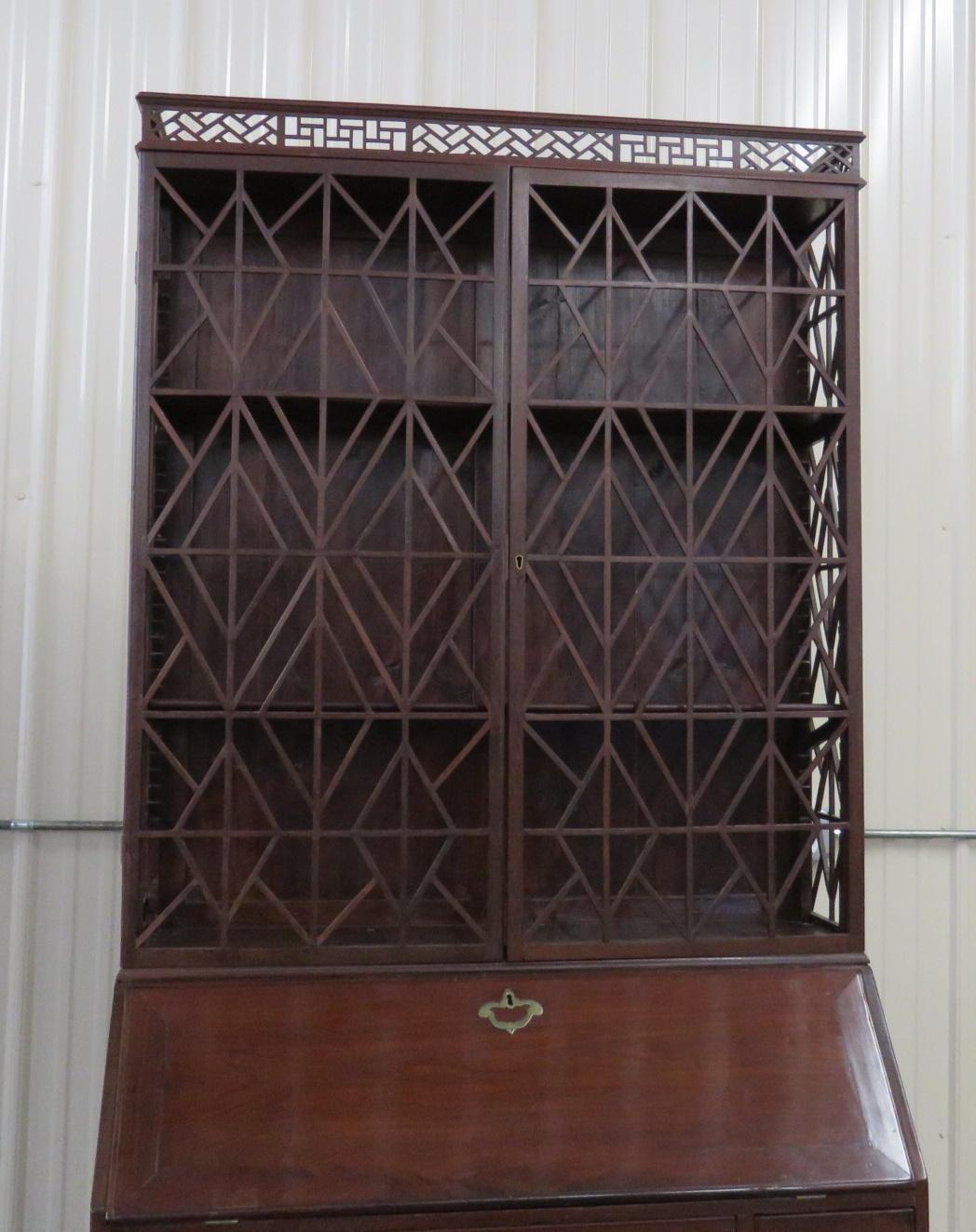 Federal style 2-door secretary desk with 6 drawers and 1 door contained behind drop desk and 6 lower drawers.