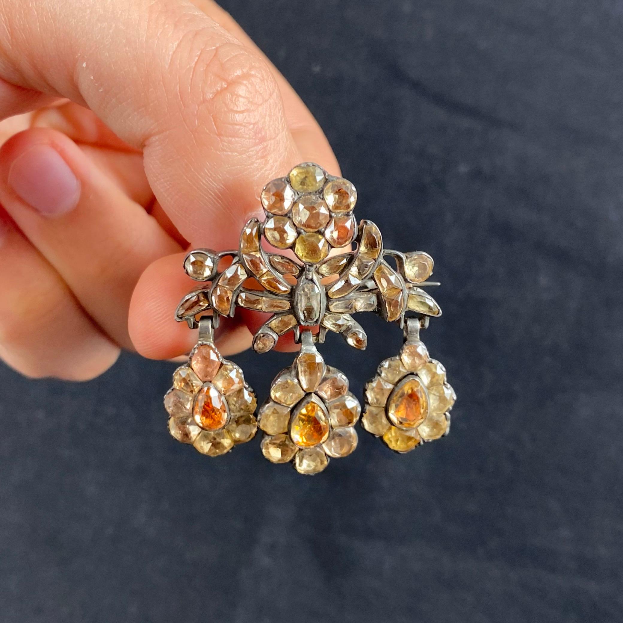 Antique 18th Century Foiled Imperial Topaz Girandole Brooch in Silver, Portuguese, circa 1770, cased. Set throughout with russet-colored topazes of different shades and shapes (including antique cushion, pear, circular and calibre), this brooch is