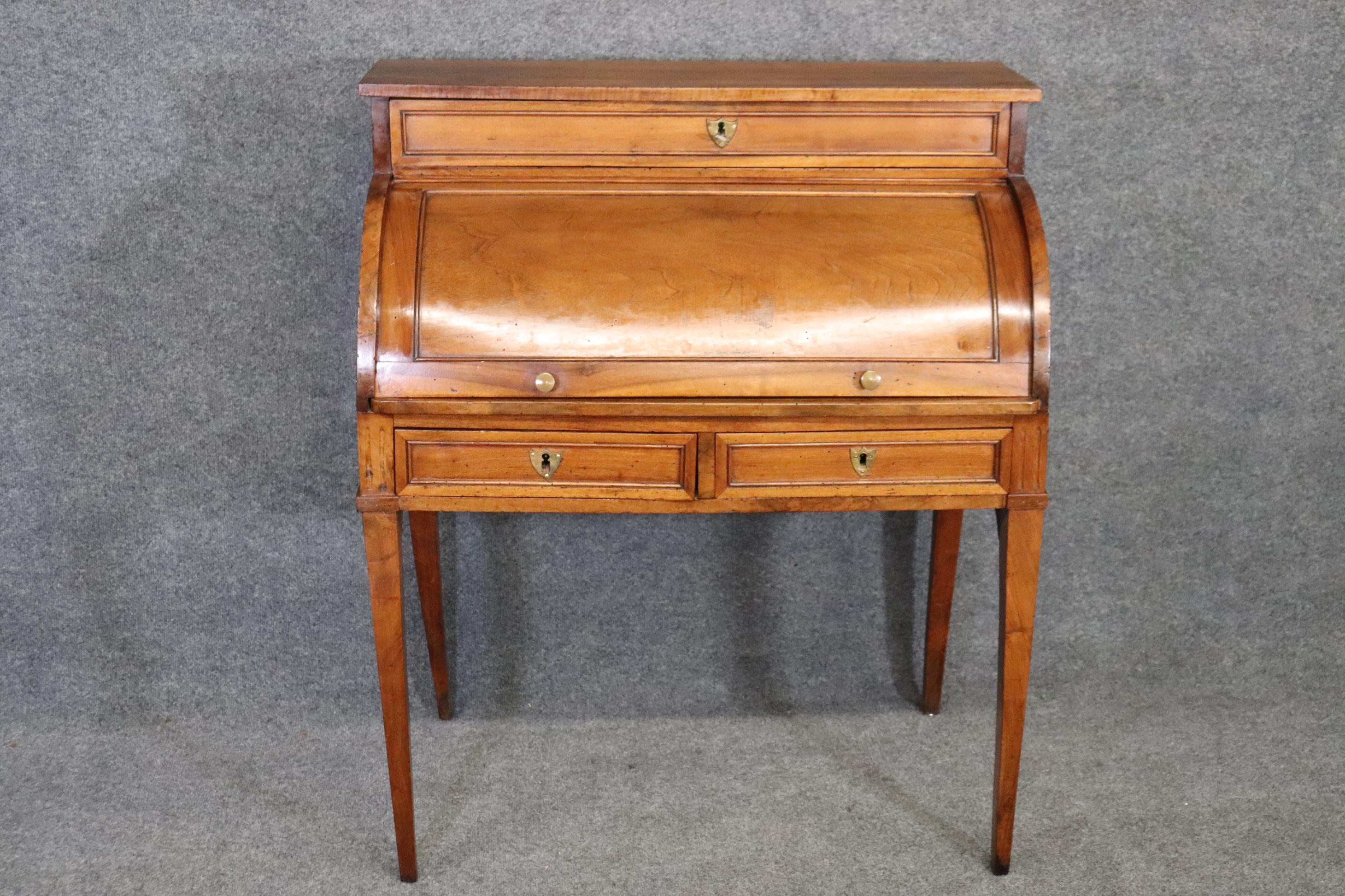 Dimensions- H: 42 3/4in W: 36 1/2in D: 20 3/4in 
This antique 18th century French Directoire style cylinder desk is made of the highest quality and is perfect for you and your home! This piece is in the French Directoire Style and is equipped with