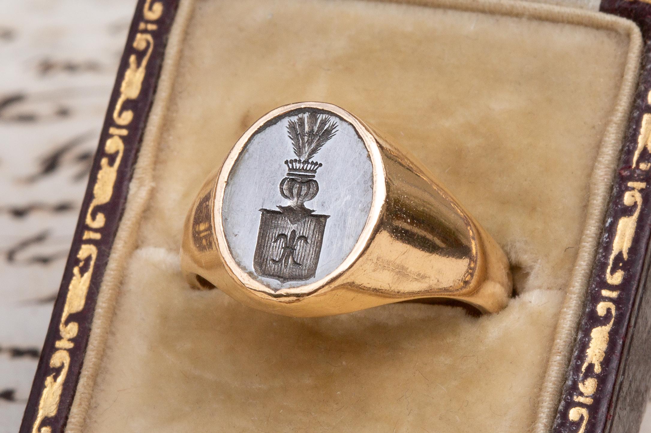 Antique Heavy French 21K Gold Napoleonic Coat of Arms Intaglio Signet Ring 

Superb engraved steel intaglio signet ring made in France dating to the late 18th century. The ring is hallmarked with a rare French ‘poinçon de décharge’ of a squirrel to