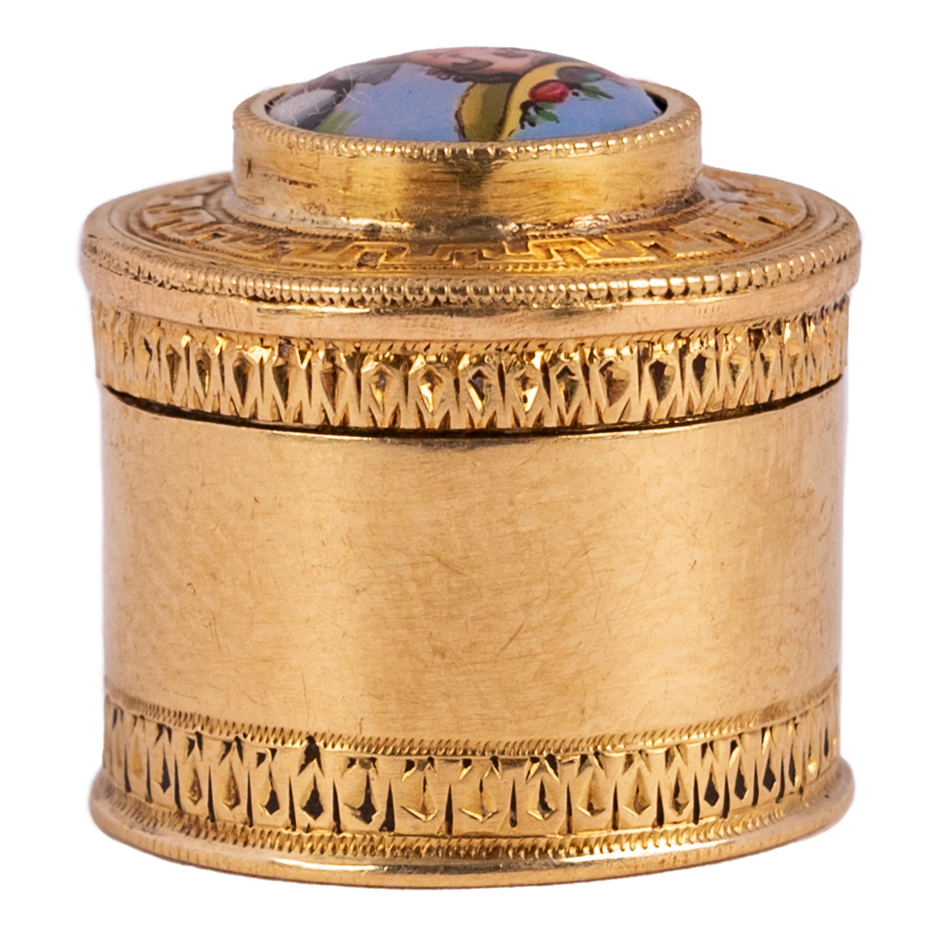 An antique French miniature 18k gold and enamel lidded patch box, circa 1780.
Patch boxes were used from the late 1600s to the early 1800s to store small black gummed silk patches of various shapes, which would be worn as beauty spots by both