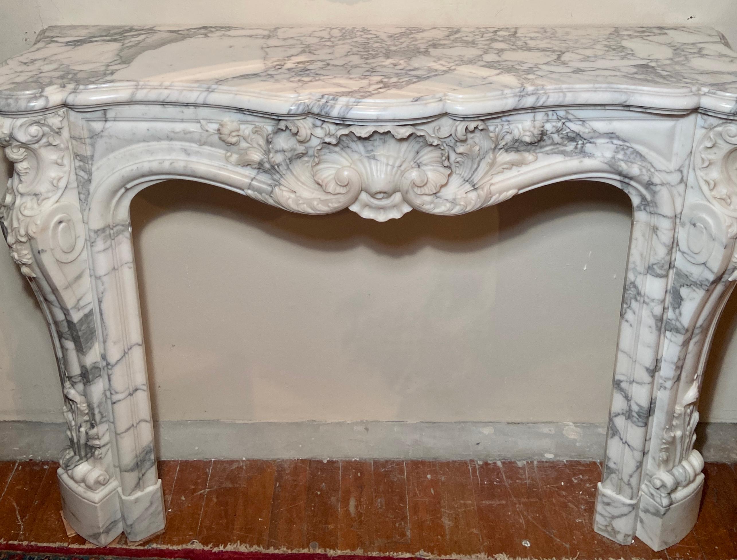 Magnificent antique 18th century French richly sculpted marble mantelpiece.