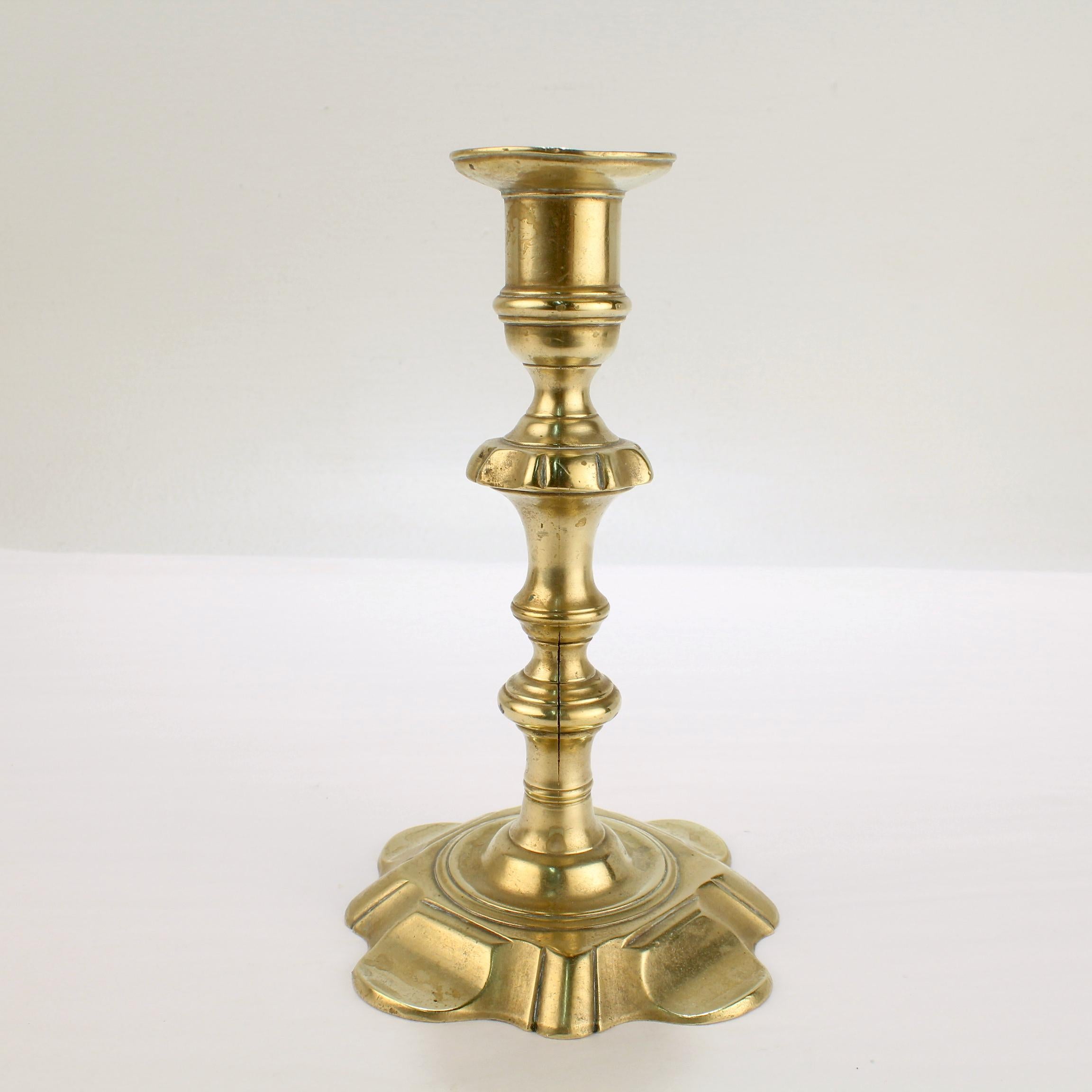 British Antique 18th Century George II English Brass Petal Base Single Candlestick  For Sale
