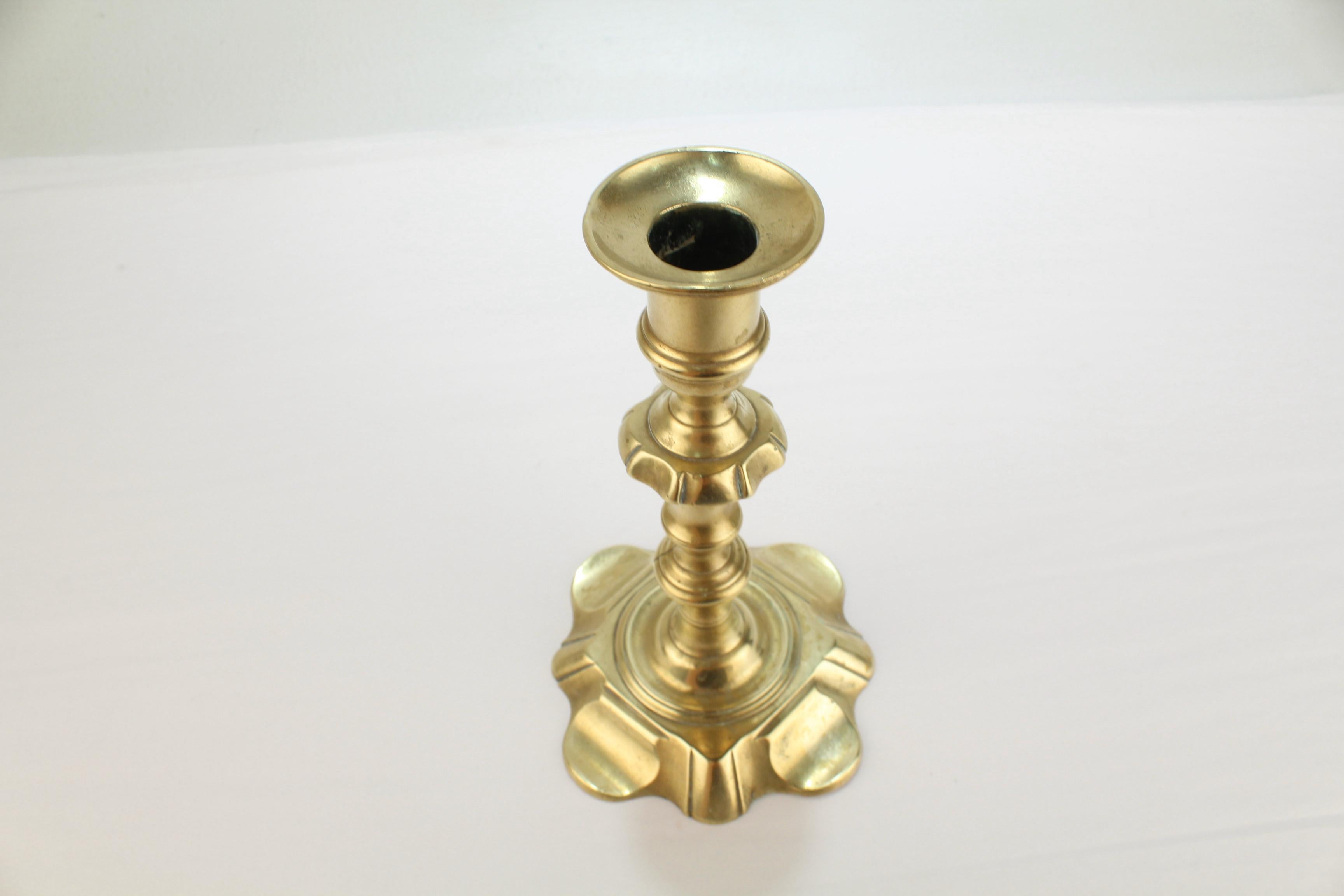 Antique 18th Century George II English Brass Petal Base Single Candlestick  In Fair Condition For Sale In Philadelphia, PA