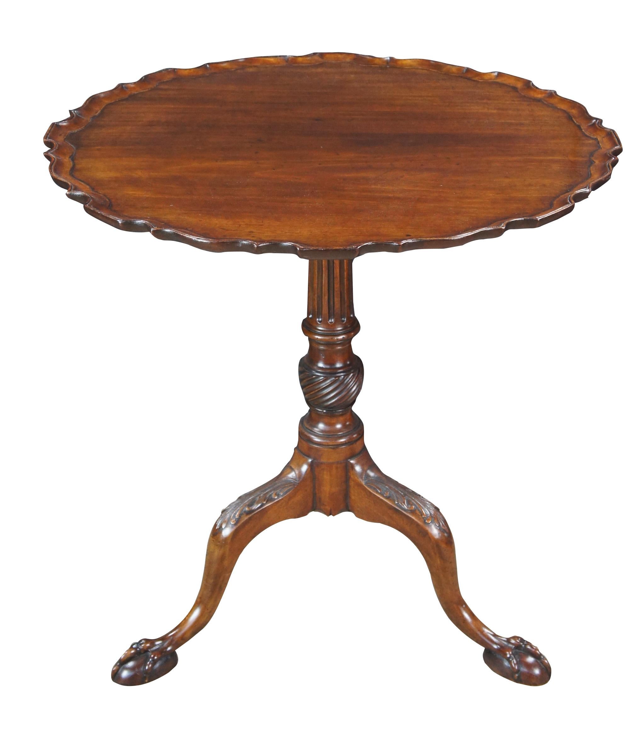 A fine 18th Century George II Pie Crust Table.  Made from solid mahogany with beautifully scalloped dish top over a fluted and twisted support surmounting to a tripod base with acanthus carved knees, cabriol legs and ball and claw feet. 