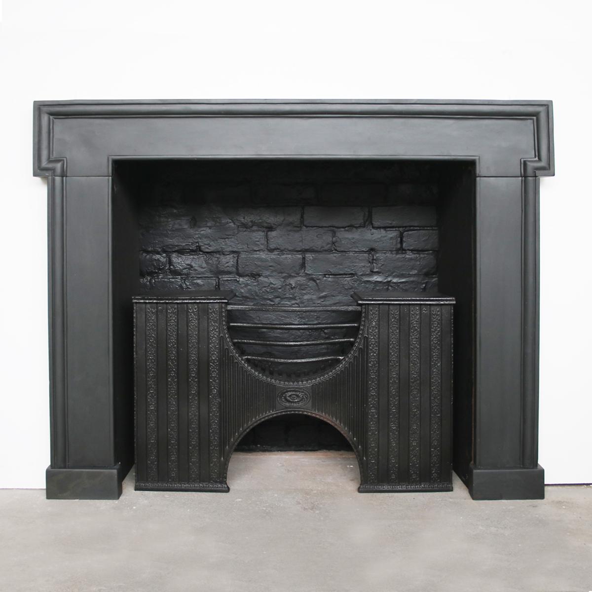 Antique 18th century Georgian slate fireplace surround of simple form with dog leg moulding. 

Pictured with an original Georgian cast iron hob grate, priced separately.