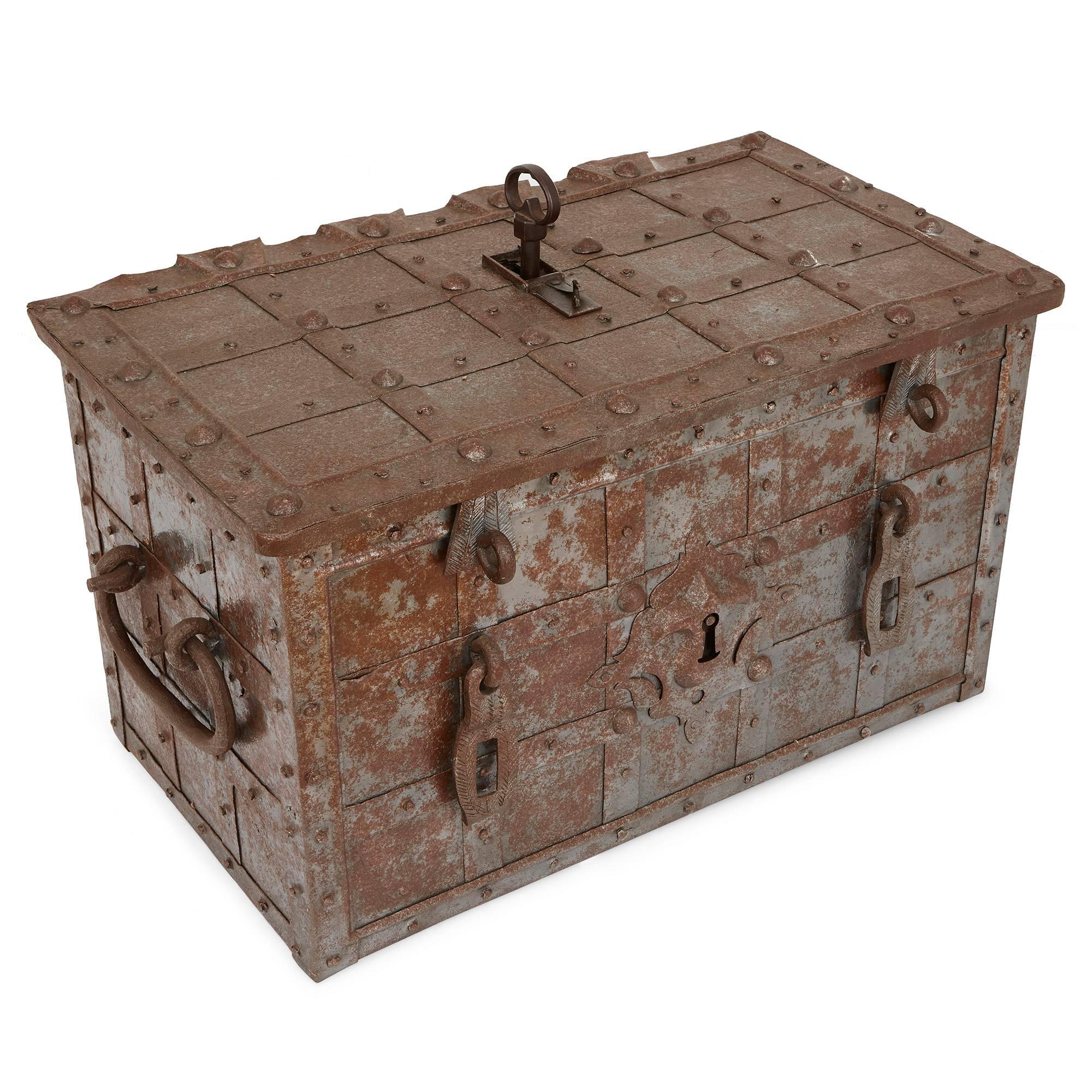 Crafted entirely of steel in rectangular form, the trunk features a pinned lattice all over the exterior and handles at either side. The top panel of the trunk can be opened by hinges at the rear, and the trunk is secured with multiple locks. There
