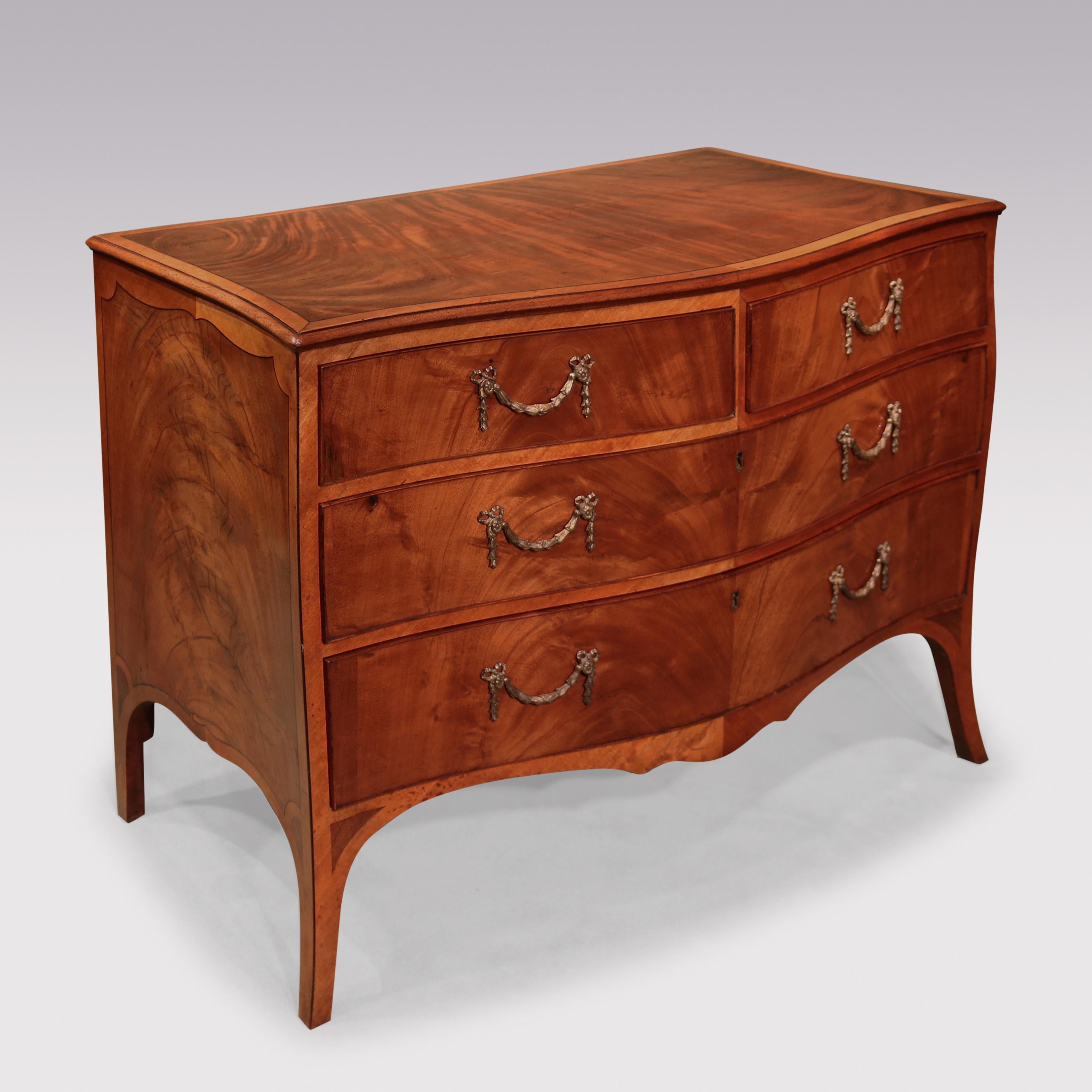 A fine late 18th Century Hepplewhite period figured mahogany serpentine Chest having book-matched, ebony strung & satinwood banded top above 2 short & 2 long rosewood cockbeaded drawers retaining original gilt brass swag & garland handles.  The