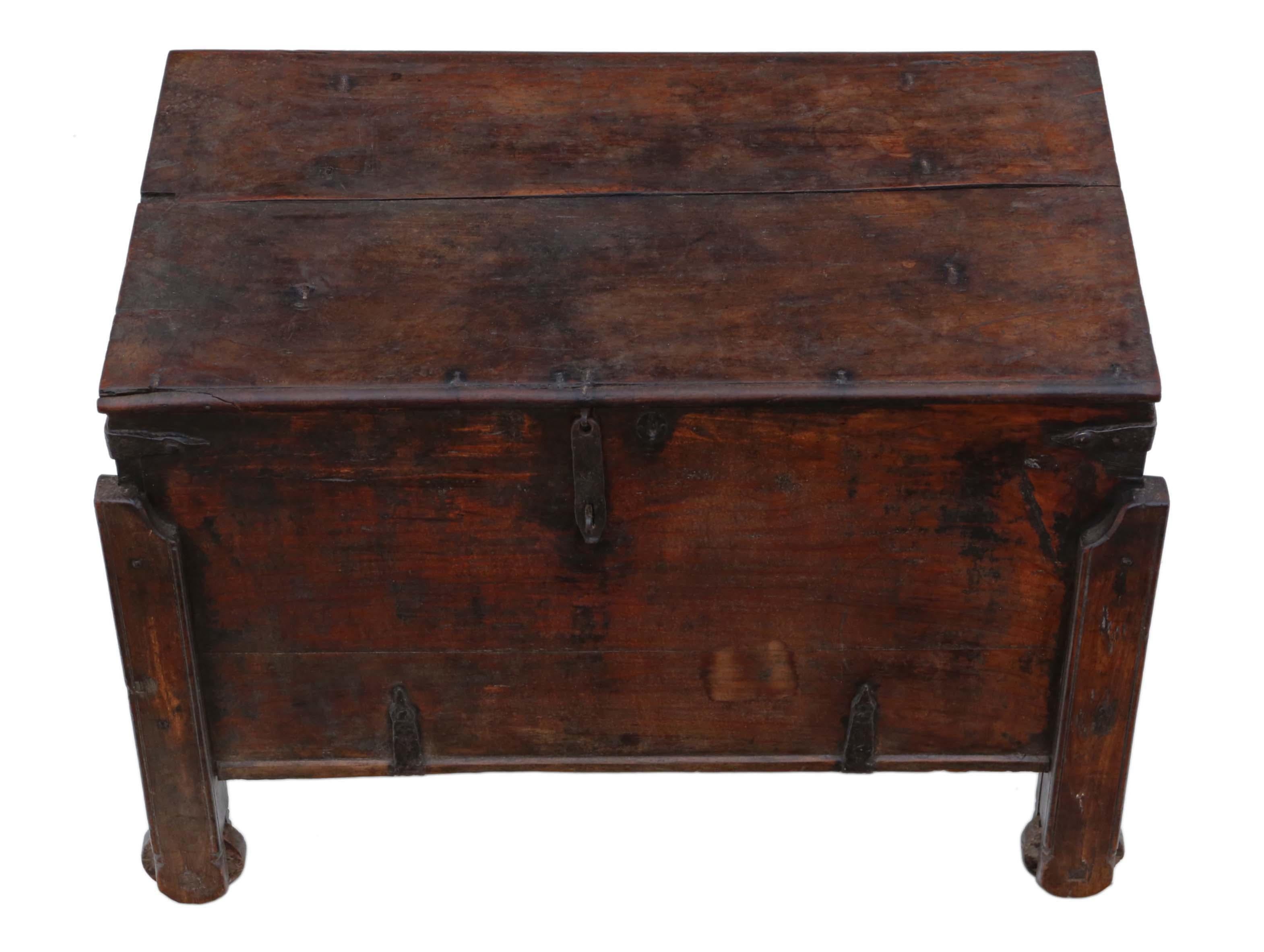 Antique 18th Century Indian/ Oriental hardwood coffer or chest. Later 19th Century corner posts with wooden wheels. Very unusual and rare.

No loose joints or woodworm. Full of age, character and charm.

Lovely iron strapping, handles and