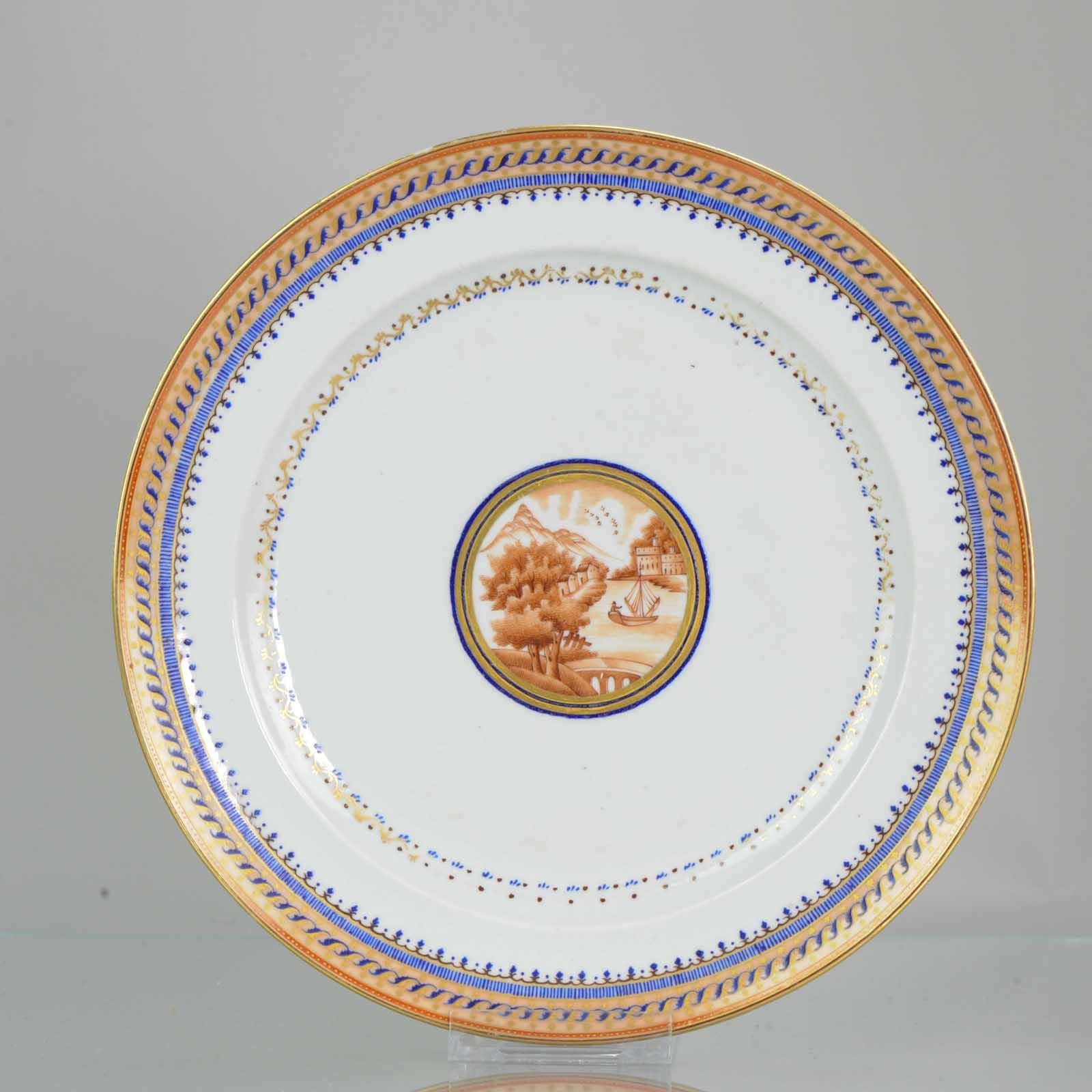 A rare, good conditioned, and quality painting plate.

Very nicely decorated piece with good details. Blue, sepia and gilt decoration, central sepia reserve 