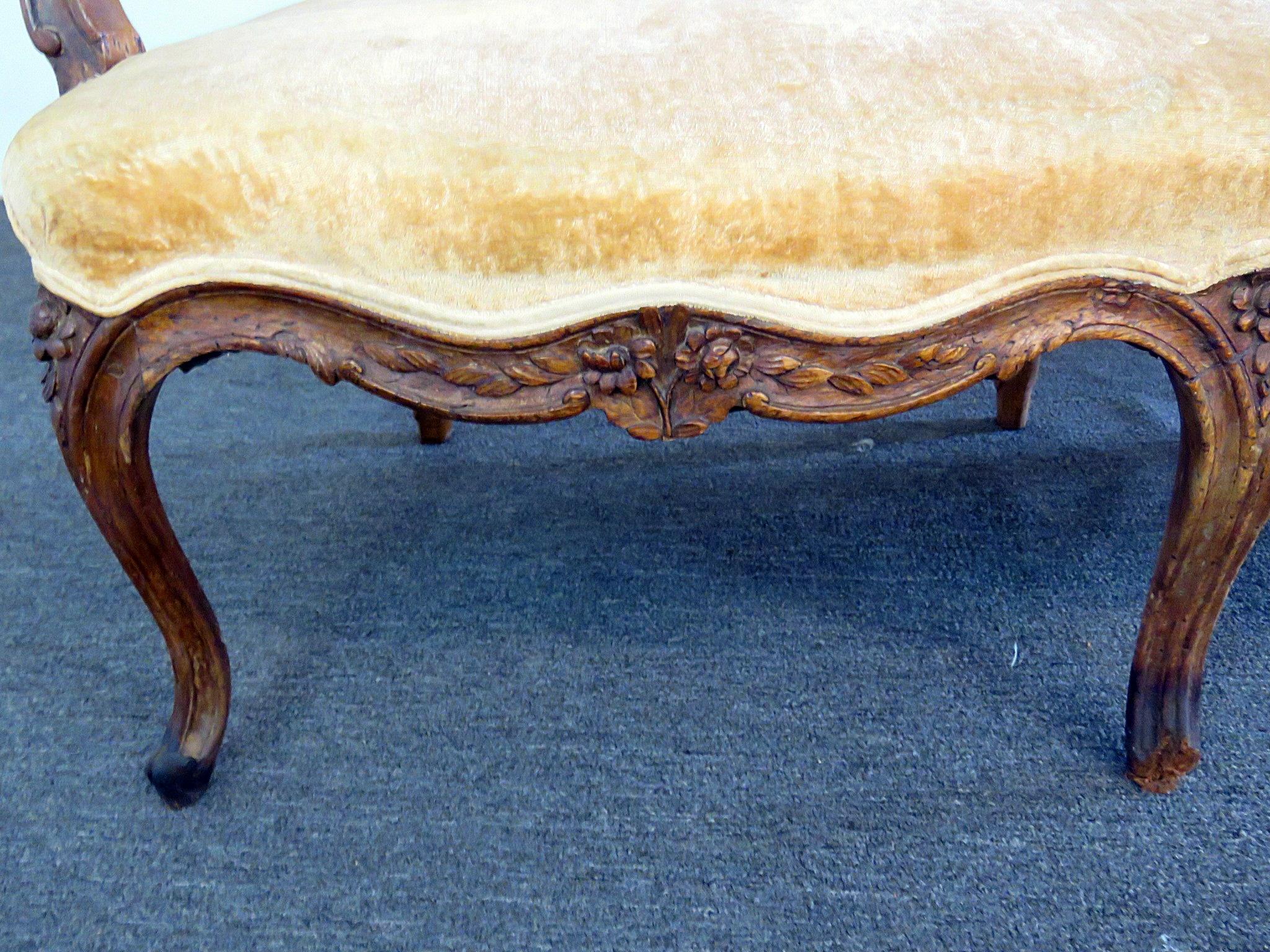 Antique 18th century carved walnut Louis XVI style sofa of large scale and of the period. This is a rare find and worthy of reupholstery and is a masterpiece.