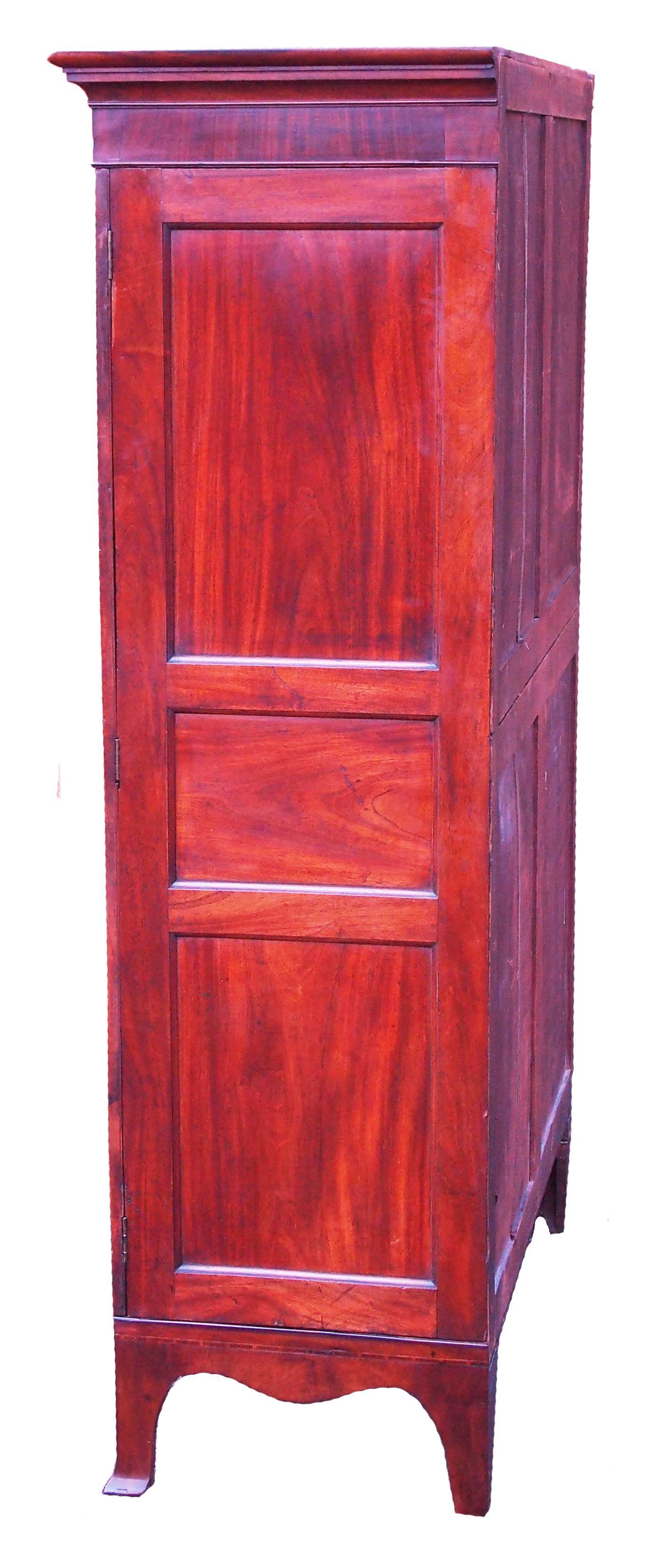 A very good quality 18th century mahogany channel
islands design full length hanging wardrobe retaining
exceptional color and patina to well figured panelled
doors and sides raised on elegant original splay feet.