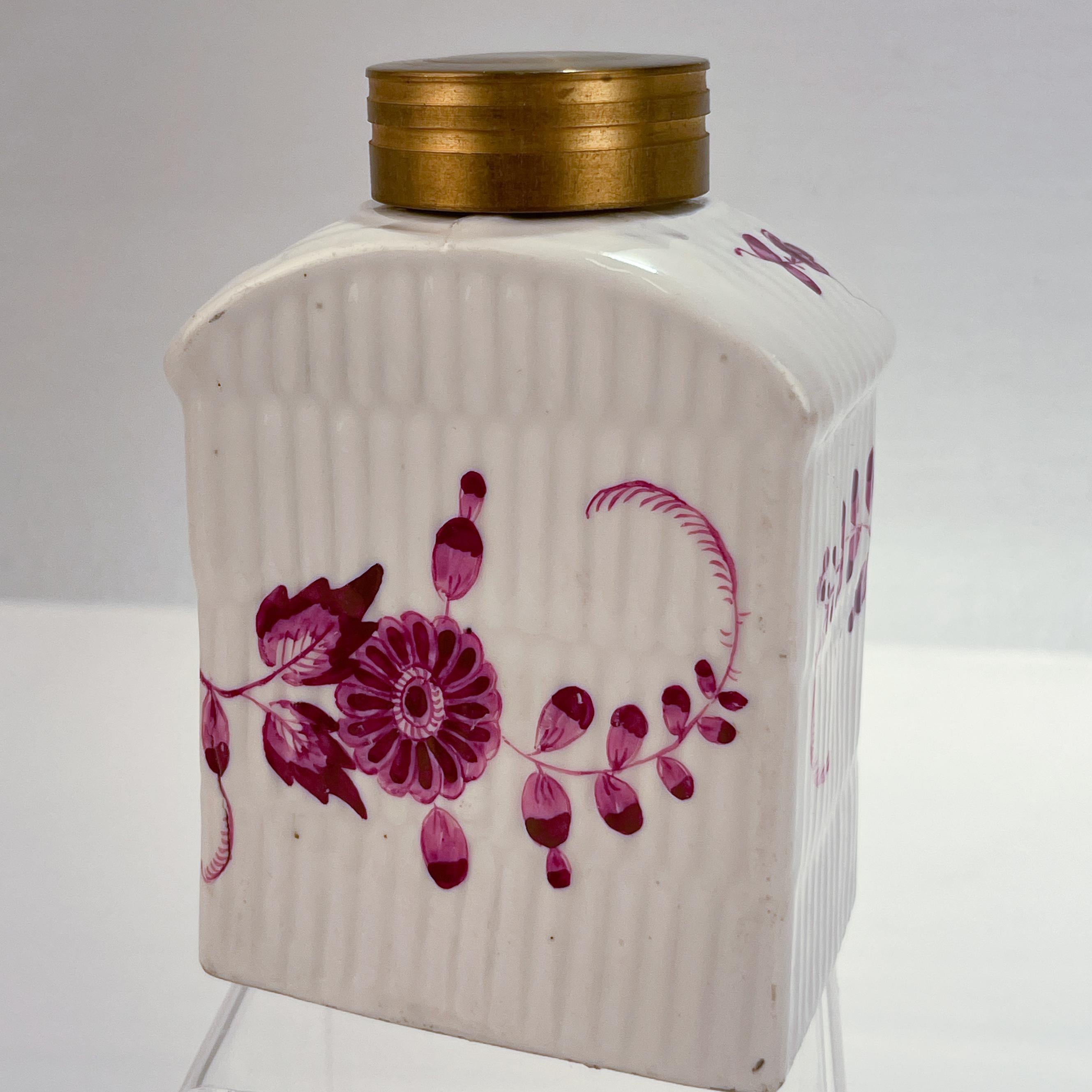 A fine Meissen Porcelain tea caddy.

With a reeded body and purple Indian hand painted decoration.

With gilt decoration and a later associated brass lid.

From the Marcolini period.

Simply a great tea caddy!

Date:
Late 18th