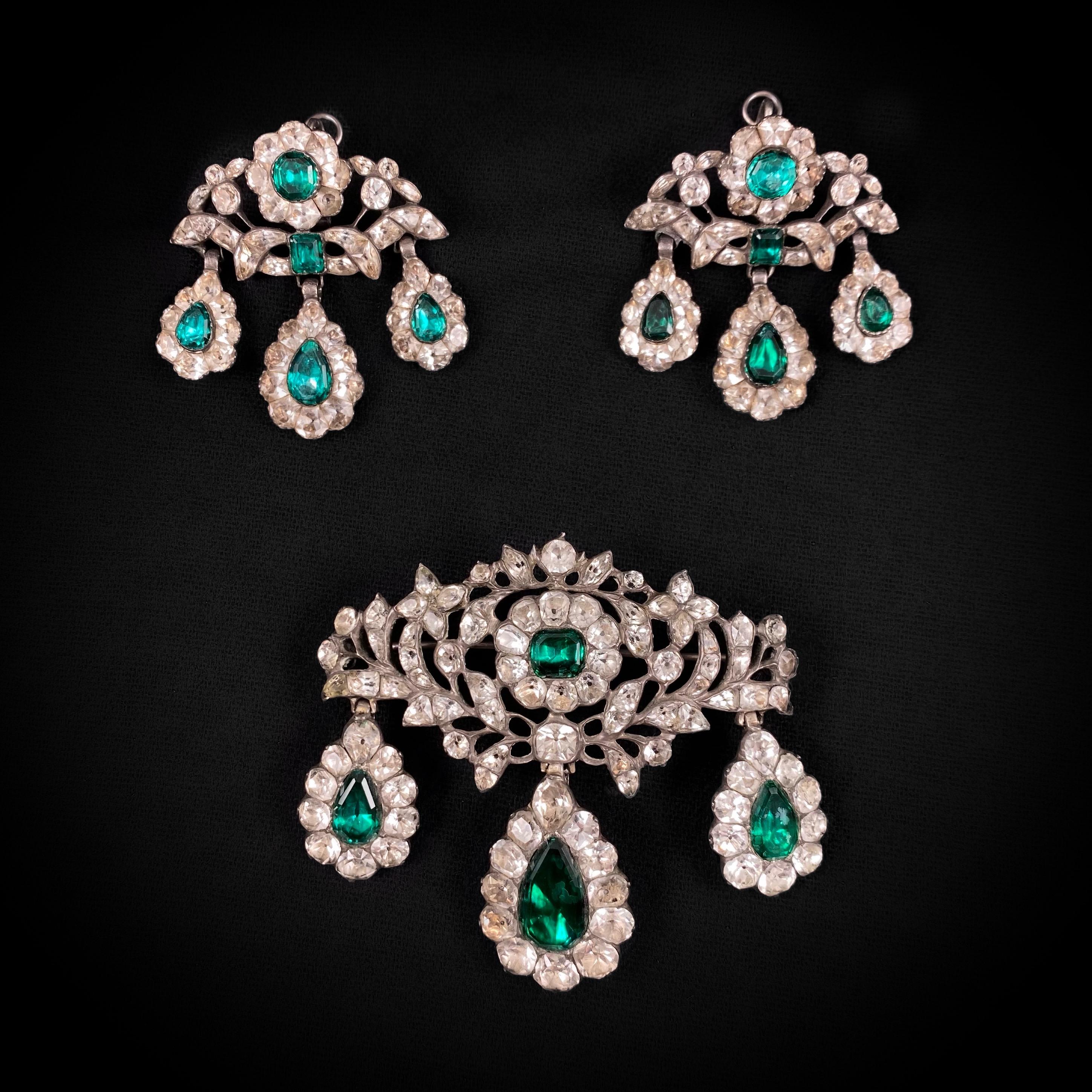 Antique 18th century “Minas Novas” rock crystal, colorless topaz and simulated-emerald doblet girandole earrings and pendant/brooch demi-parure, Portuguese, circa 1770. A spectacular antique jewelry set accented with “Minas Novas” rock crystal