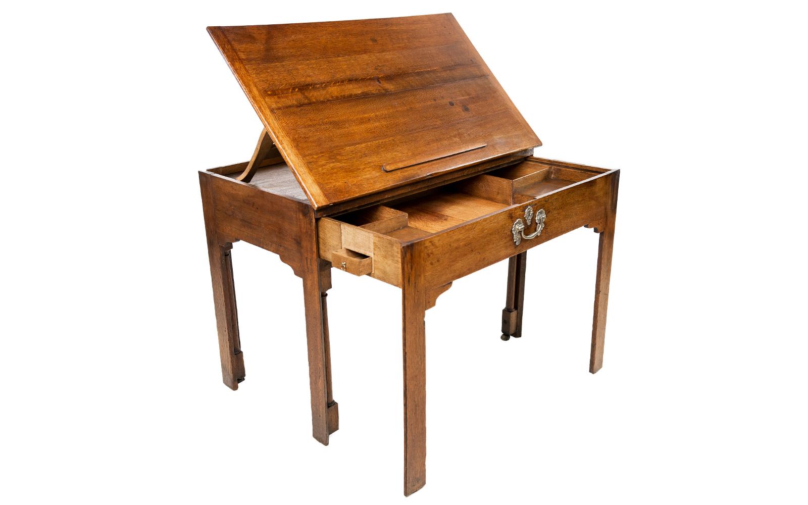 Architects drawing table

An oak adjustable drawing table or desk. The hinged top with easel support behind, the drawer extends forward on part of the cluster leg. A rare piece in superb original order.

The hinged top adjusts to various angles,
