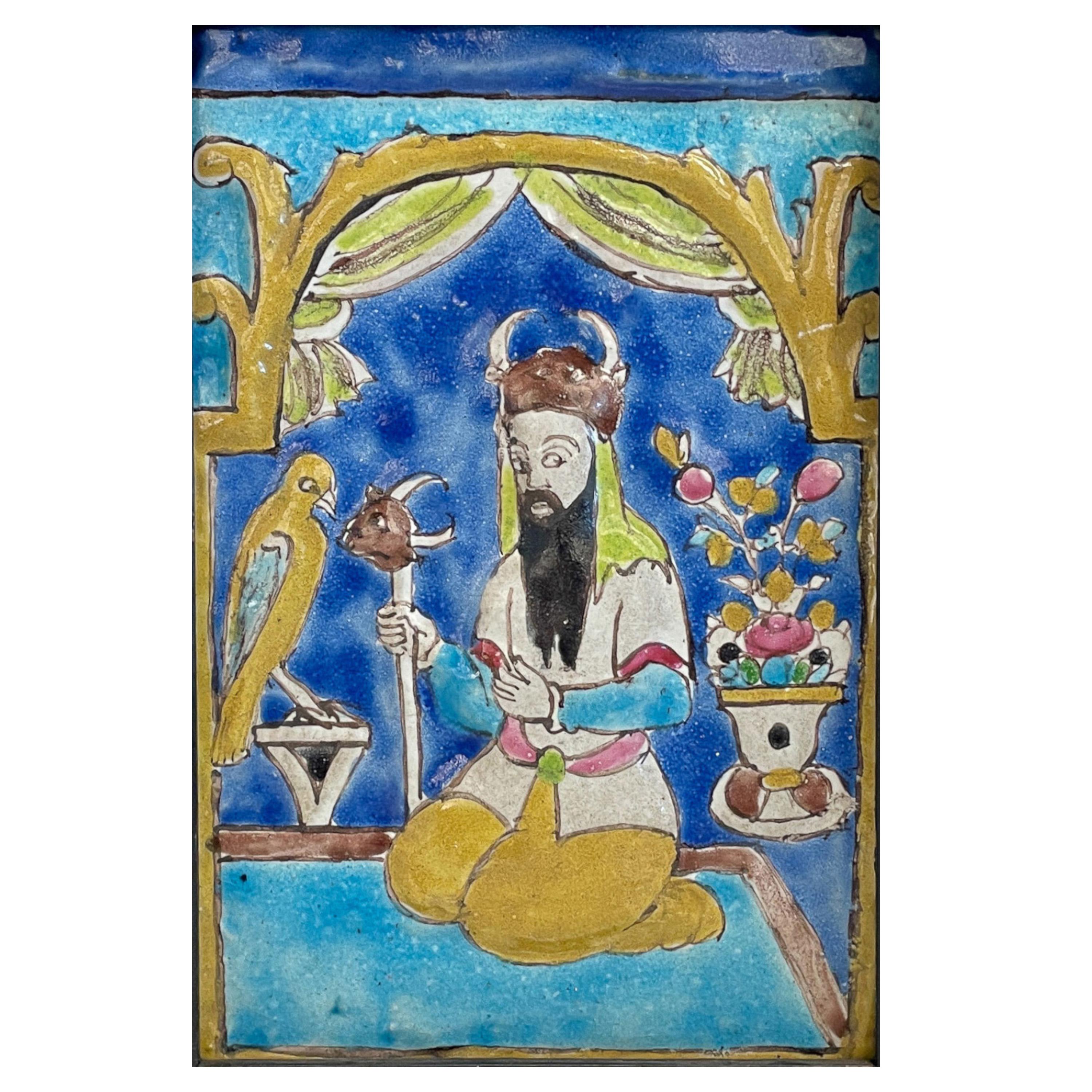 Important Antique 18th Century Persian Islamic Safavid Cuerda Seca Pottery Tile depicting the legendary Persian hero Rostam, circa 1700.

The tile shows Rostam kneeling, wearing a tunic and a horned helmet, holding a scepter with deer-head finial,
