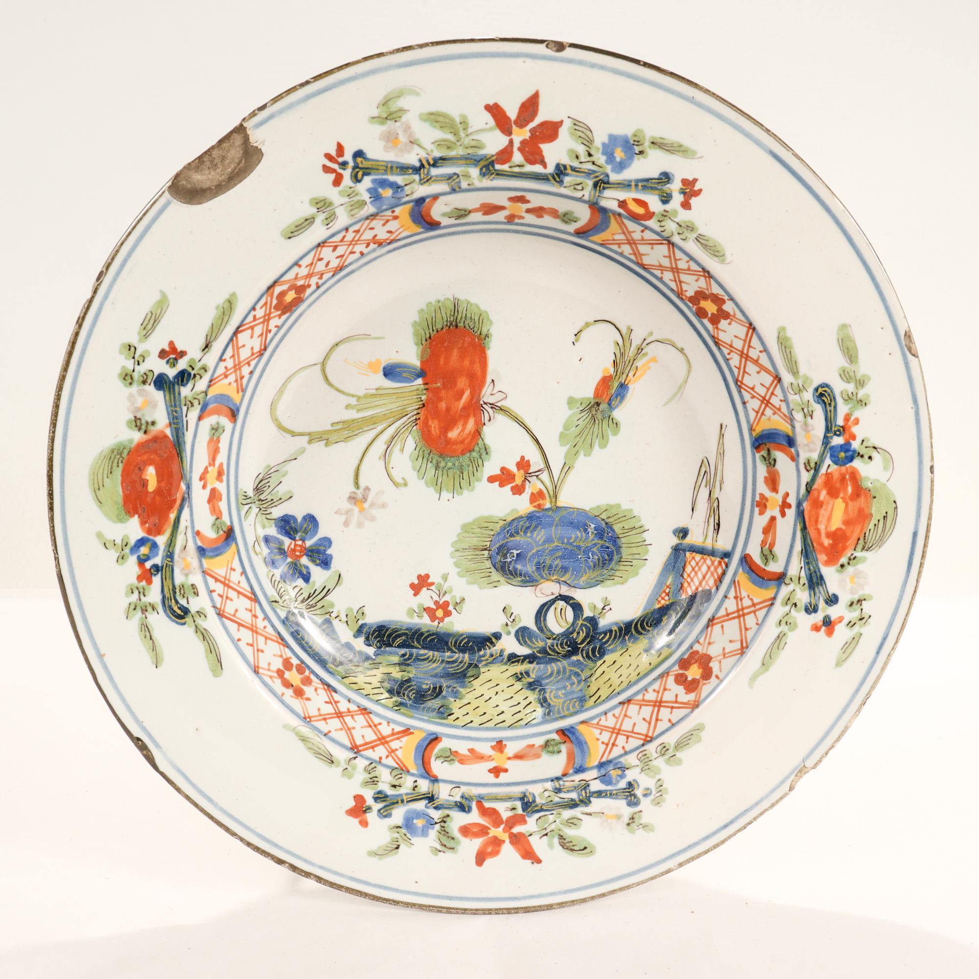 A fine antique 18th century Dutch Delft bowl.

With painted floral chinoiserie decoration throughout in red, blue, yellow, & green.

The reverse bears an old store price tag.

Simply a wonderful Dutch Delft bowl!

Date:
Mid-18th