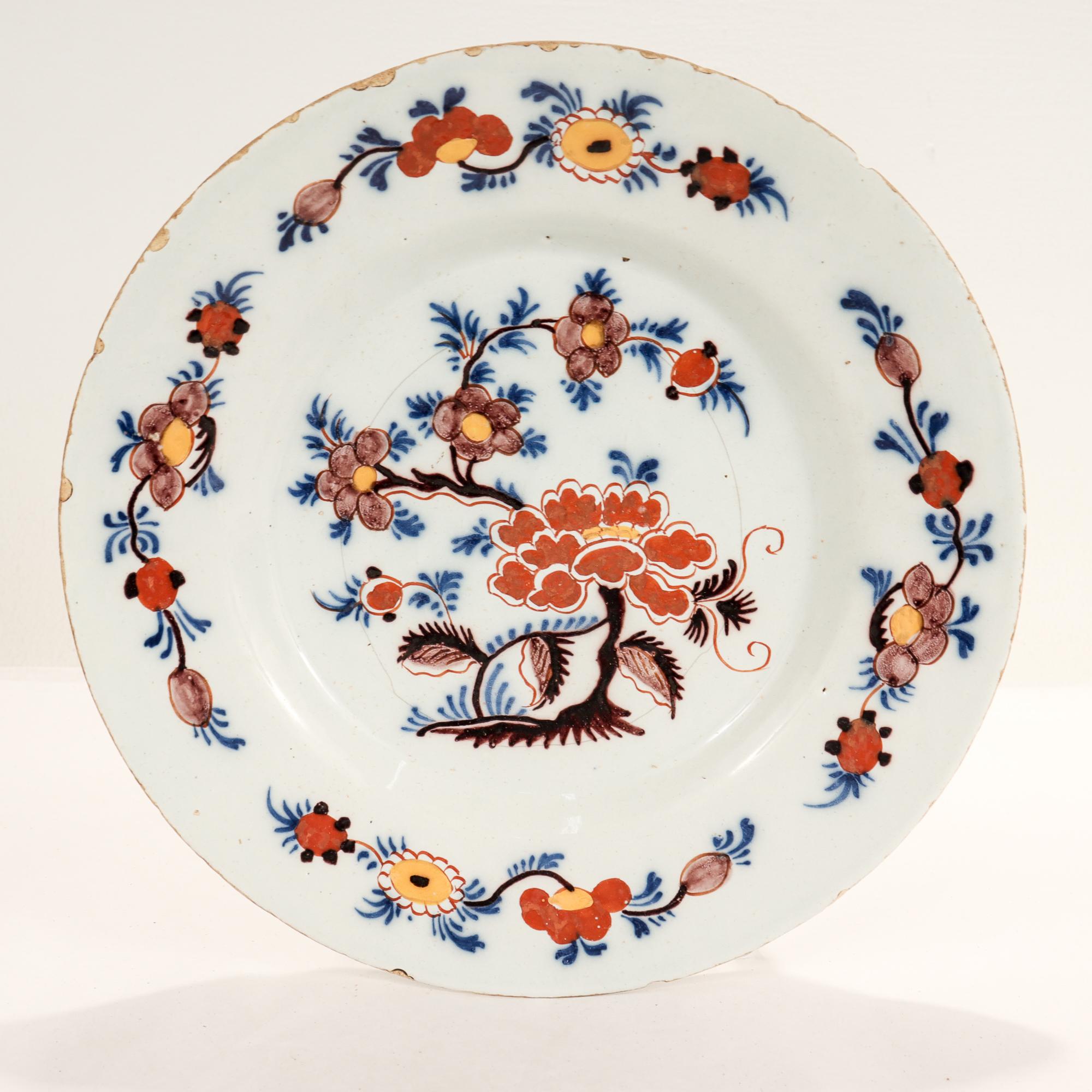 Ancienne assiette Delft hollandaise polychrome du 18e siècle en vente