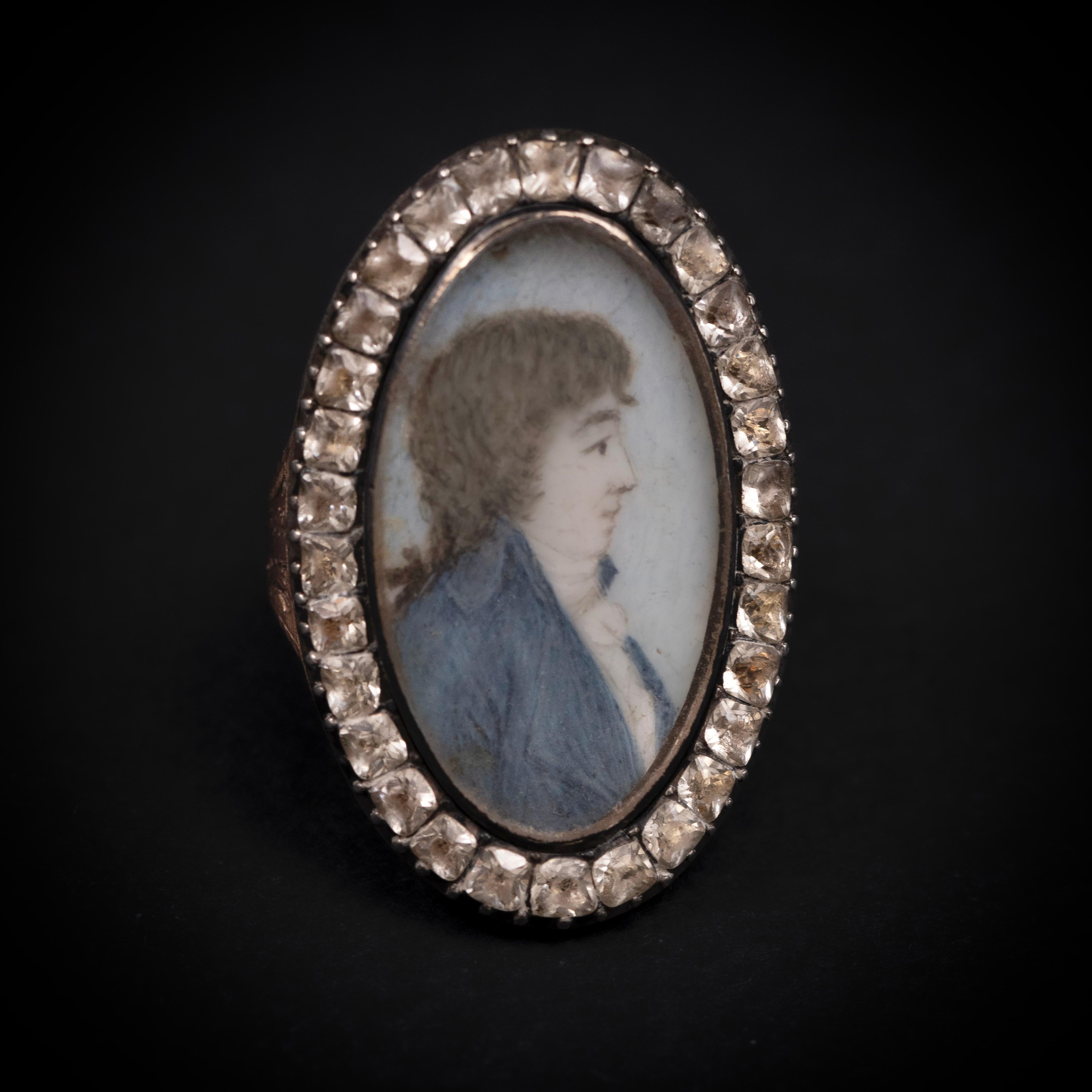 18th Century Portrait Miniature and Strass Ring in Silver and Rose Gold, English or French, circa 1780-1900. A rare and elegant late 18th-century portrait ring, featuring a finely hand-painted miniature of a nobleman in profile, dressed in a blue