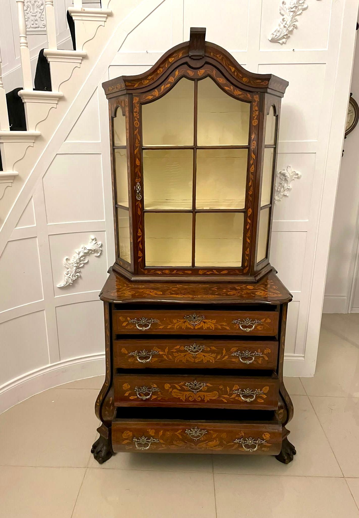 Antique 18th century quality Dutch marquetry walnut display cabinet on chest having a quality walnut floral marquetry inlaid display cabinet with a single glazed door and sides opening to reveal two shaped shelves above a walnut floral marquetry