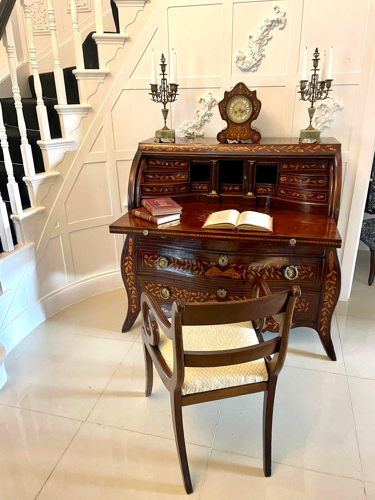 Antique 18th century quality mahogany floral marquetry inlaid cylinder bureau having a fantastic quality mahogany floral marquetry inlaid cylinder bureau opening to reveal a fitted interior consisting of ten shaped drawers, bookends and a door