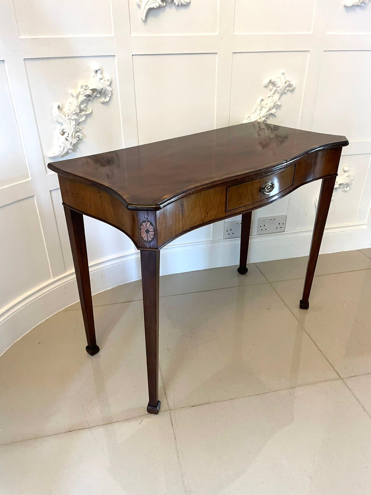 Antique 18th century George III quality mahogany Hepplewhite serpentine shaped side table having a quality mahogany serpentine shaped side table with a satinwood crossbanded edge, serpentine shaped shell inlaid frieze with a single drawer original