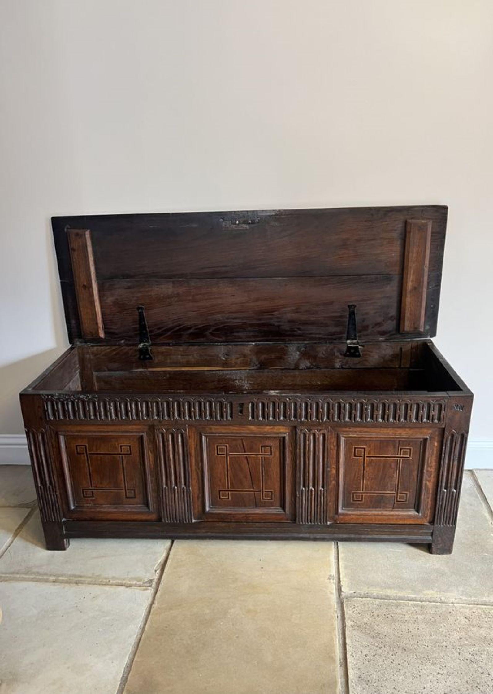 Antique 18th century quality oak coffer having a quality oak lift up lid opening to reveal a large storage compartment, carved frieze three inlaid panels with moulded edges to the front.

D. 1780