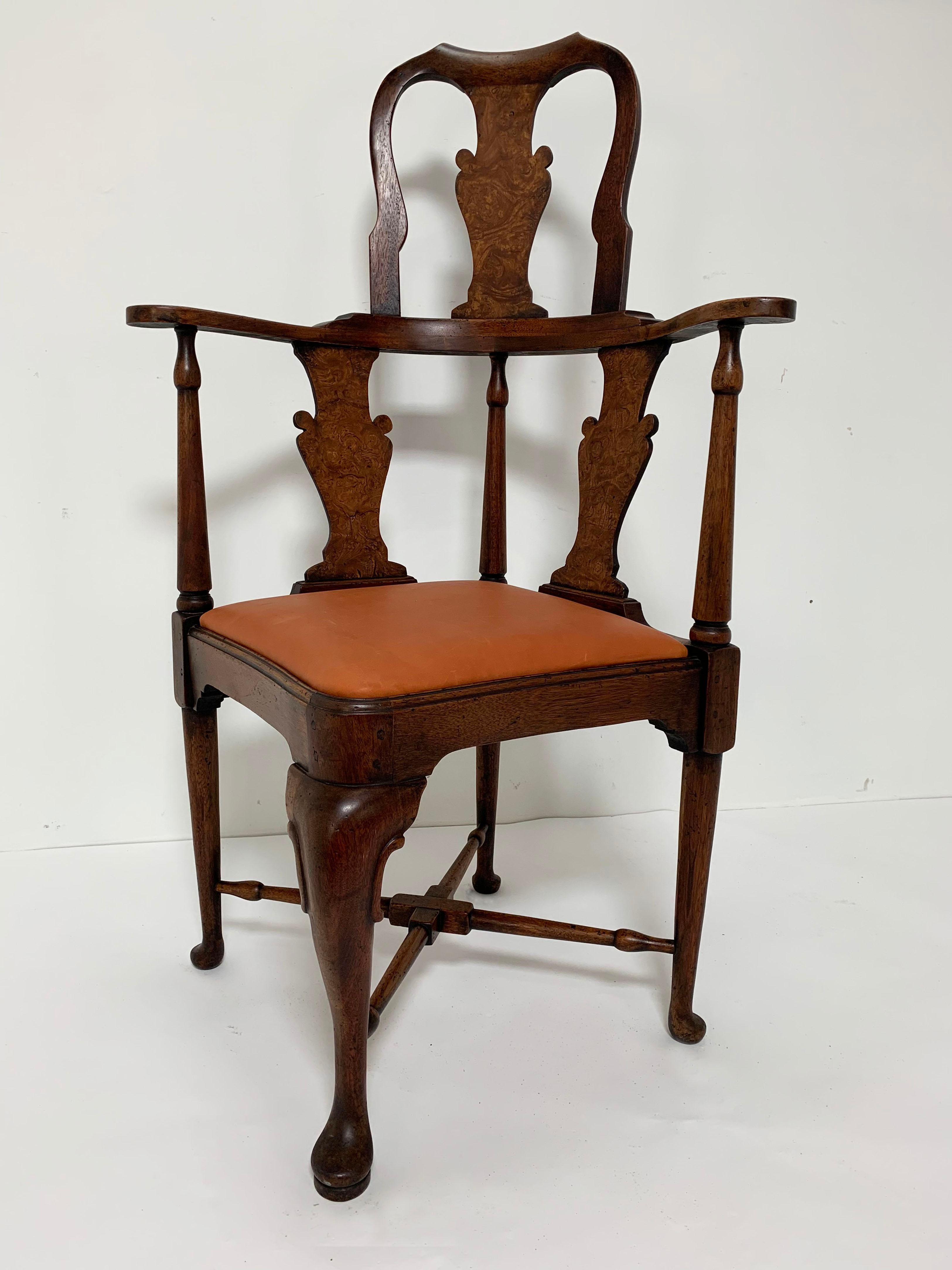 18th century, circa 1750, English Queen Anne high-back corner chair in walnut with vasiform splats of burl wood. Upholstered in cordovan leather.
   
  