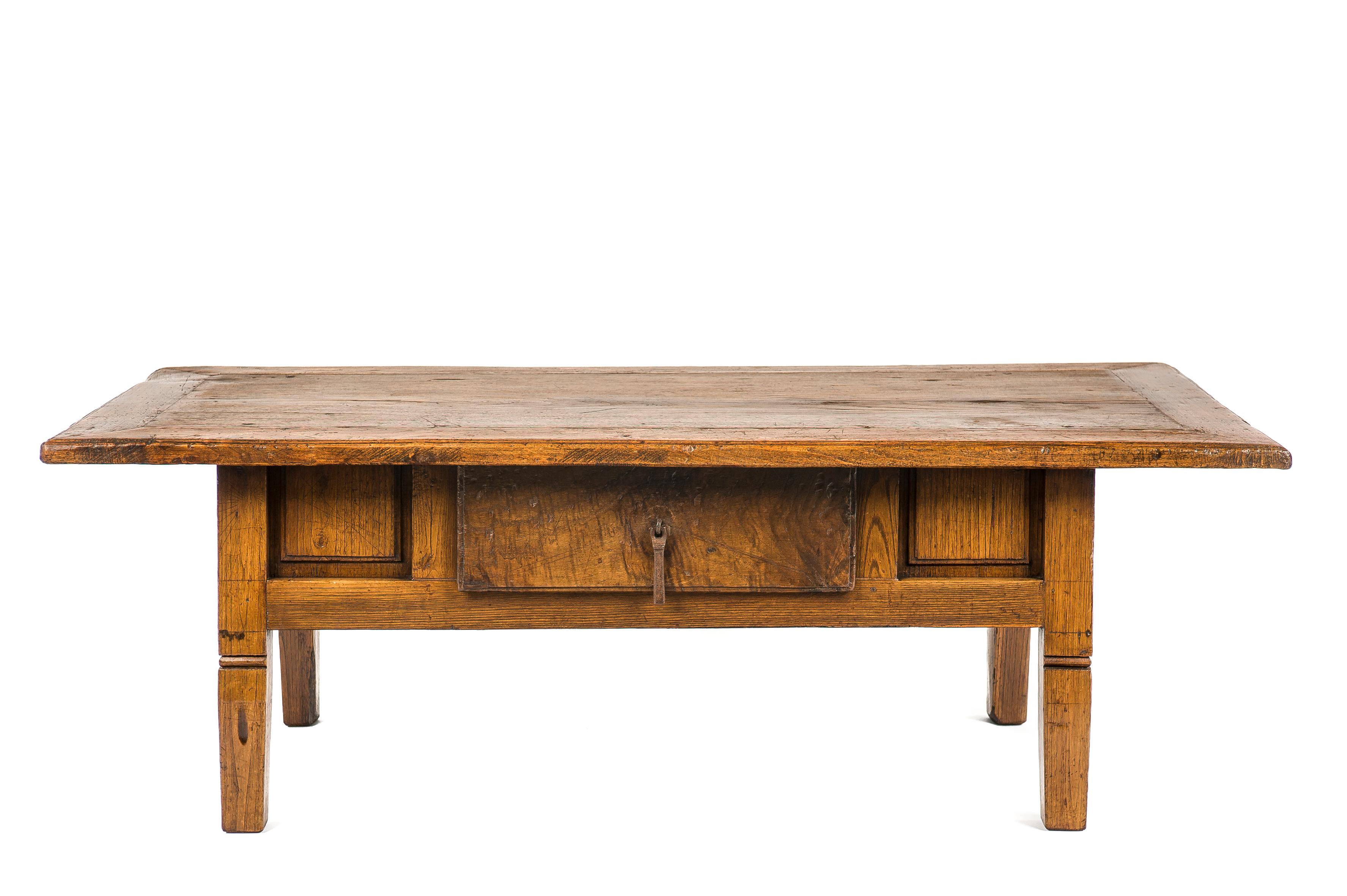 This beautiful honey color rustic coffee table or low table originates in Spain and dates circa 1780. The table has a beautiful paneled top with a central single piece of solid chestnut wood. The top has a beautiful patina with deep gloss and shows