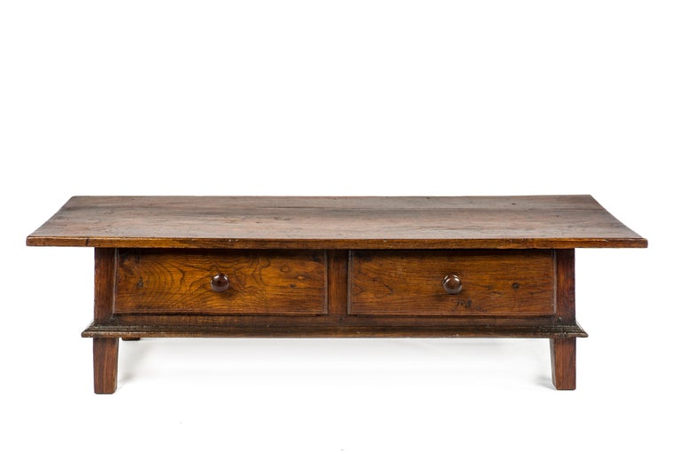 This beautiful warm brown color rustic coffee table or low table originates in rural Spain and dates circa 1770. The table has a fantastic top that was made from two handsome boards of solid chestnut wood of 1,18 inches thick and features a molding