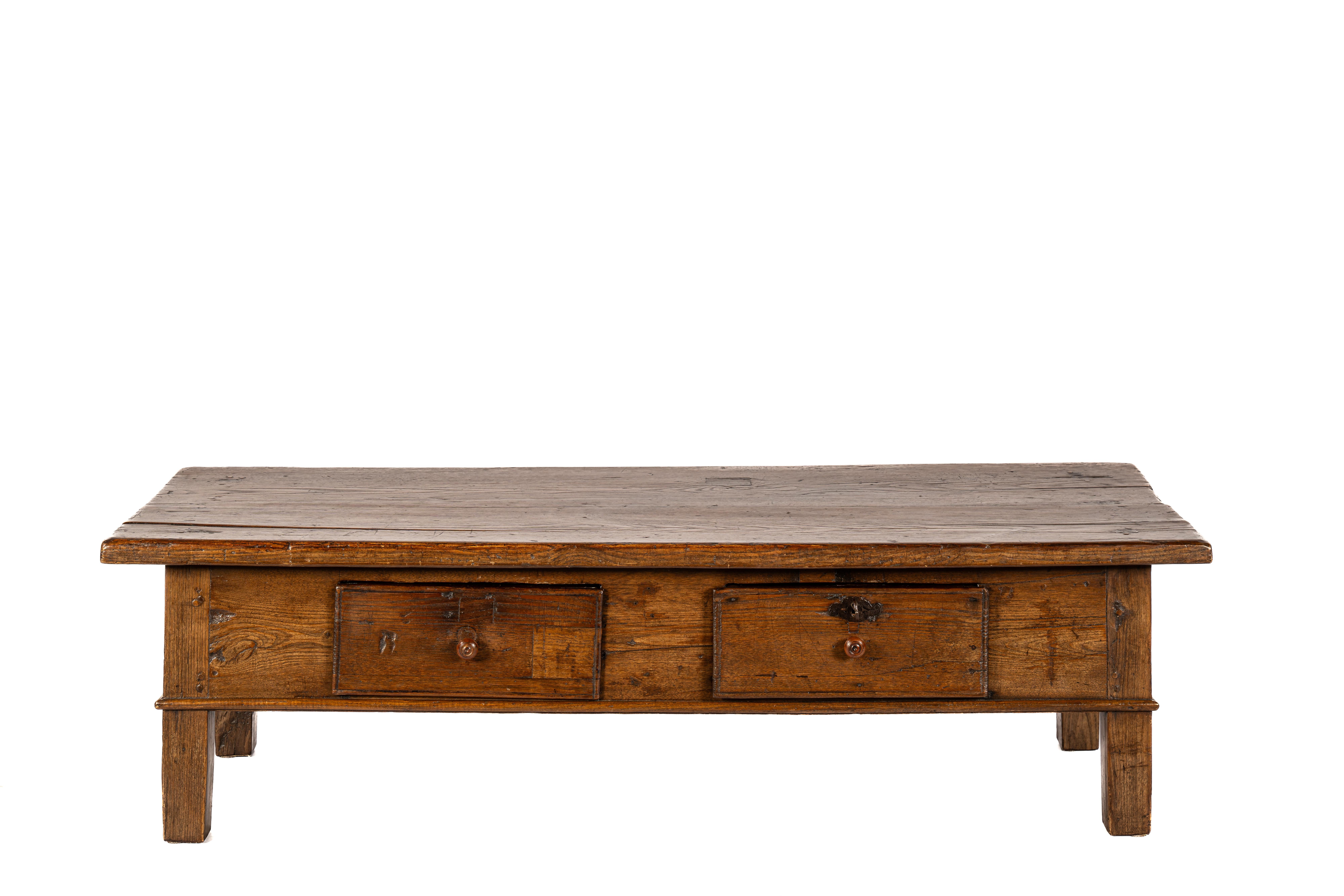 This Spanish coffee table, crafted from solid chestnut wood, is a beautiful example of functional yet elegant craftsmanship from the first half of the 19th century. The table reflects the character of rural southern Spain, where simplicity and