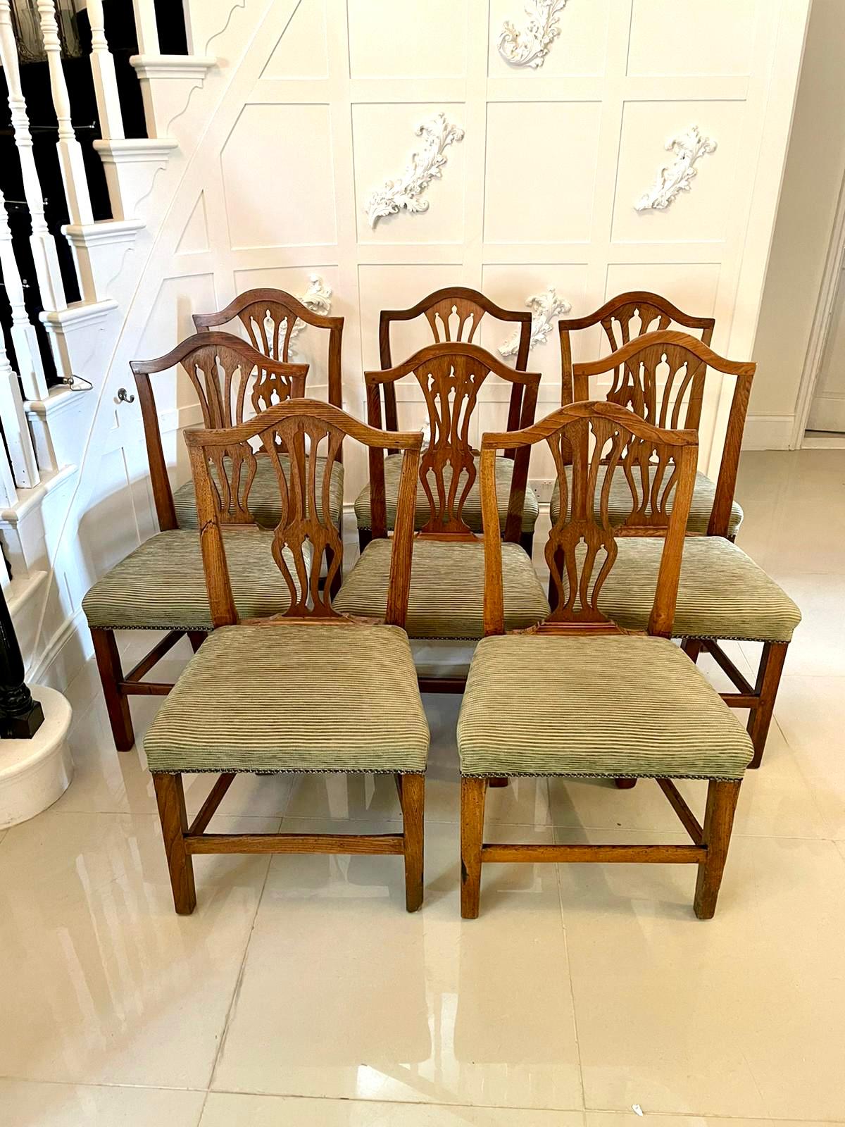 Antique 18th century set of eight George III Hepplewhite oak dining chairs 

Antique set of eight George III Hepplewhite oak dining chairs having a shaped top rail, shaped splat to the centre and upholstered seats standing on square legs to the