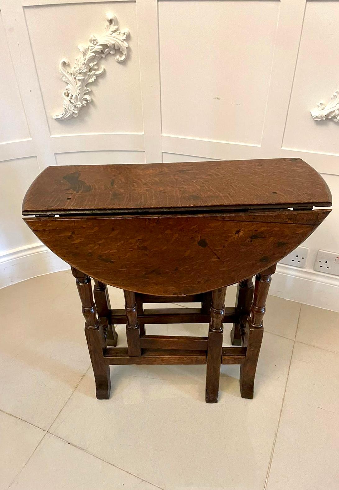 Antique 18th century small quality oak gateleg table having a quality oak top with drop leaves standing on turned supports swing out gatelegs united by oak stretchers 

A charming table of desirable proportions boasting a fabulous age related