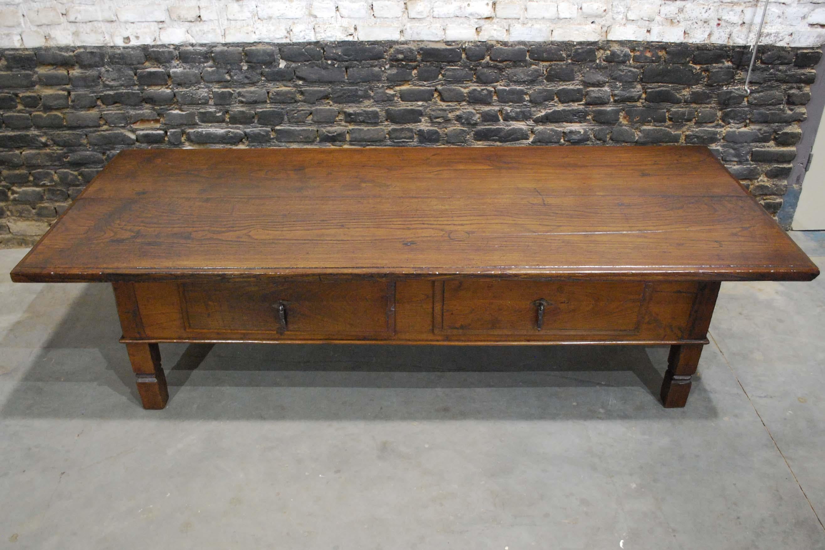 A beautiful rustic mid-18th century low table or coffee table that originates in Spain.
The table is completely made in solid chestnut wood. The 1.18 inch thick top is made of two pieces of timber. The wood shows a remarkably fine wood grain