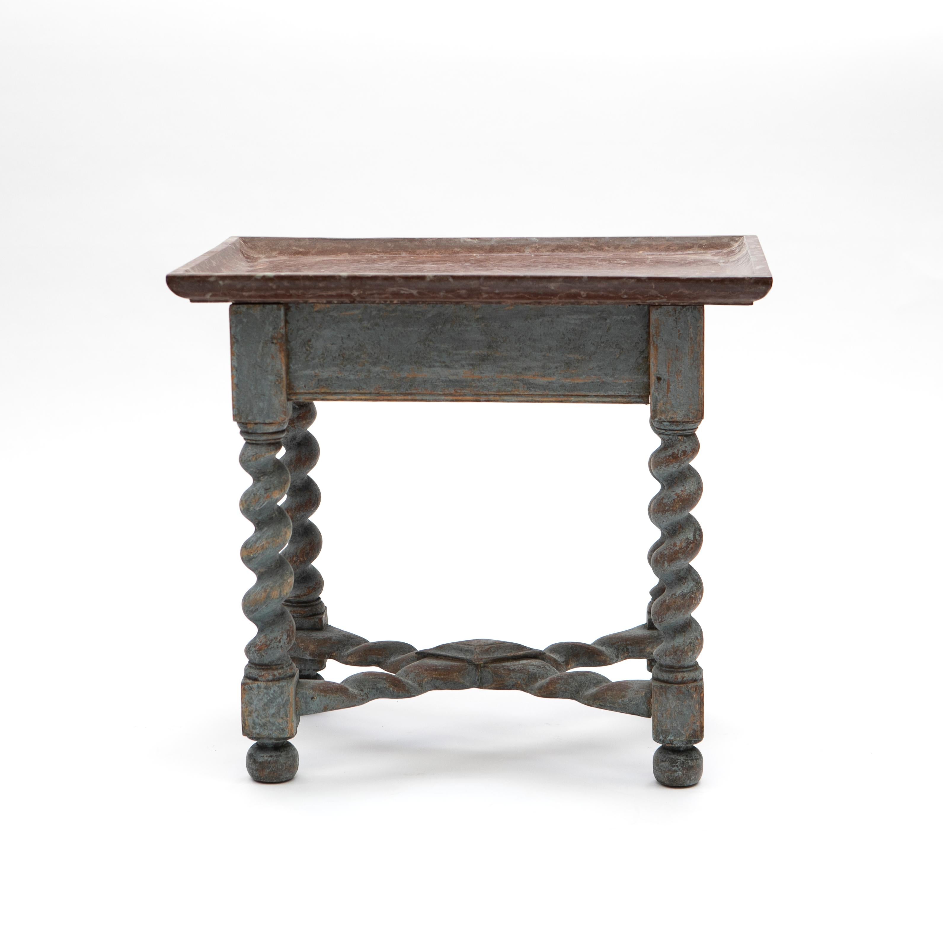 Swedish Baroque table with limestone tray table top.
Rouge Öland limestone top table above a light blue painted pine frame with corkscrew legs and X-stretcher ending in turned feet.
Later professional painted.

A beautiful and decorative