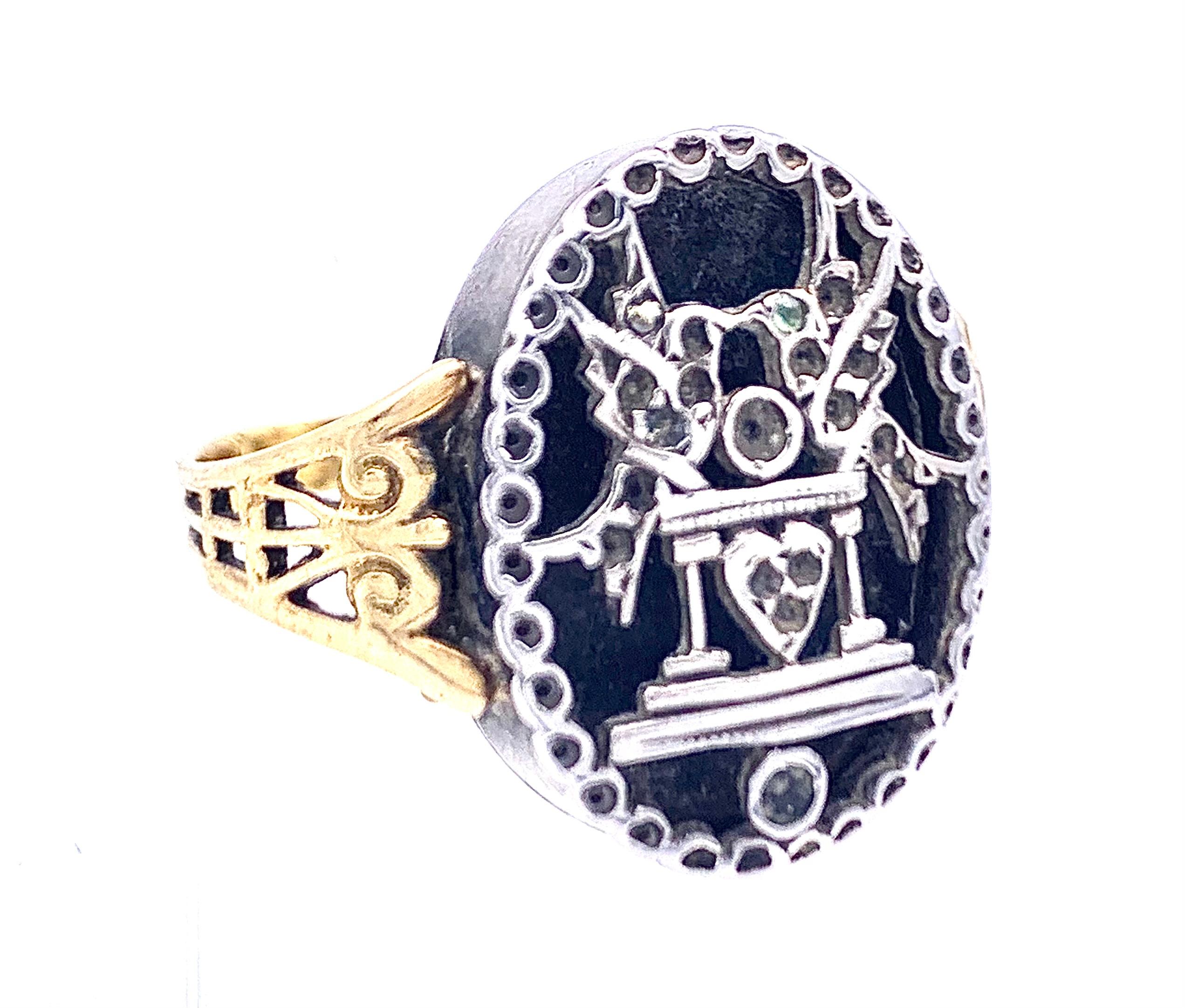 This is a rare example of an 18th century vinaigrette ring, the pierced lid opens to house a little sponge that has been soaked in perfume.  The lid is decorated with two turtle doves sitting on a balustrade over a heart.
All stones with the