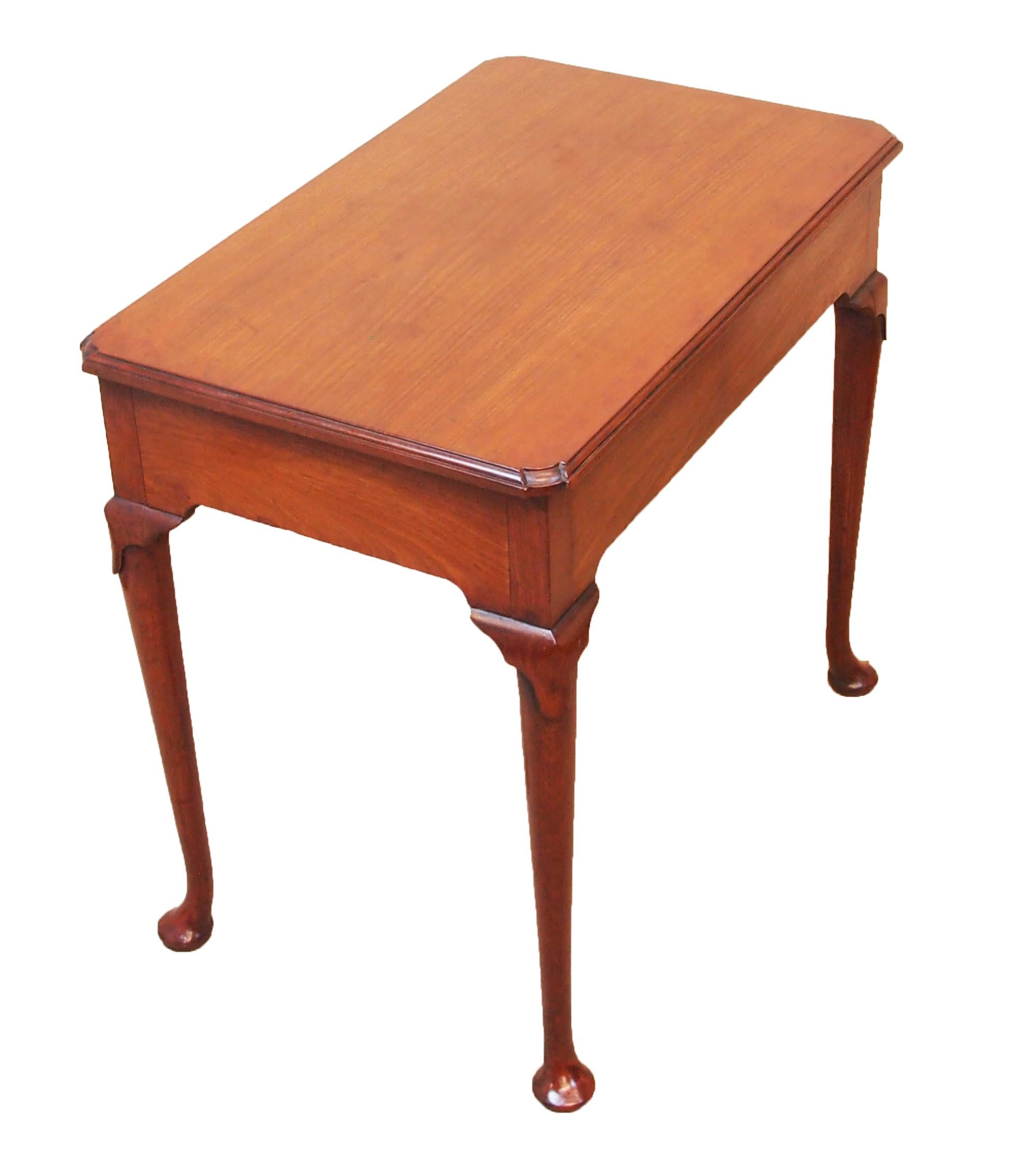 A very attractive 18th century George II Period walnut side.
Table, retaining warm patina and colour throughout, having
well figured top with re-entrant corners above one frieze.
Drawer raised on elegant cabriole legs
Terminating on original pad